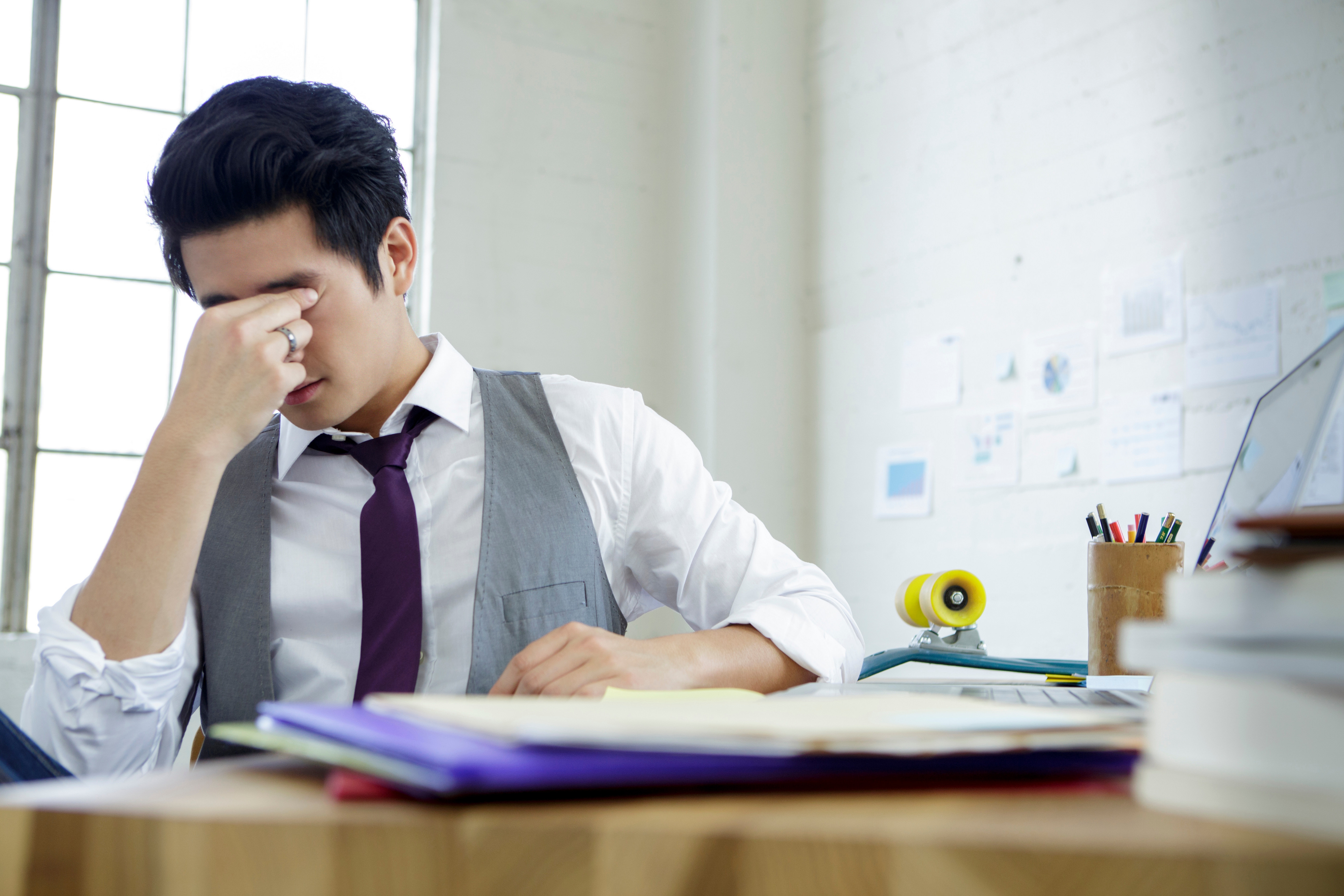 man-stressed-sitting-desk