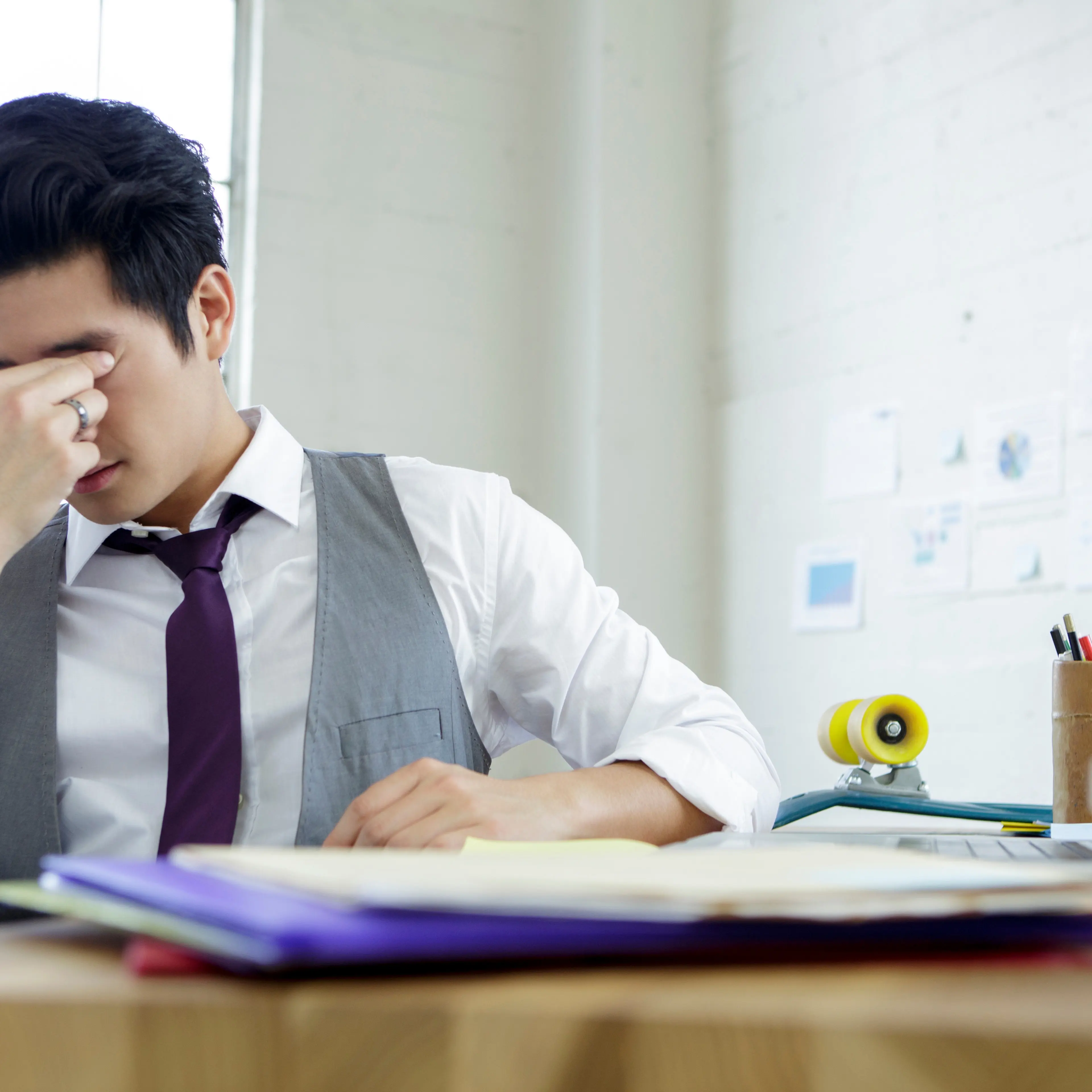 man-stressed-sitting-desk
