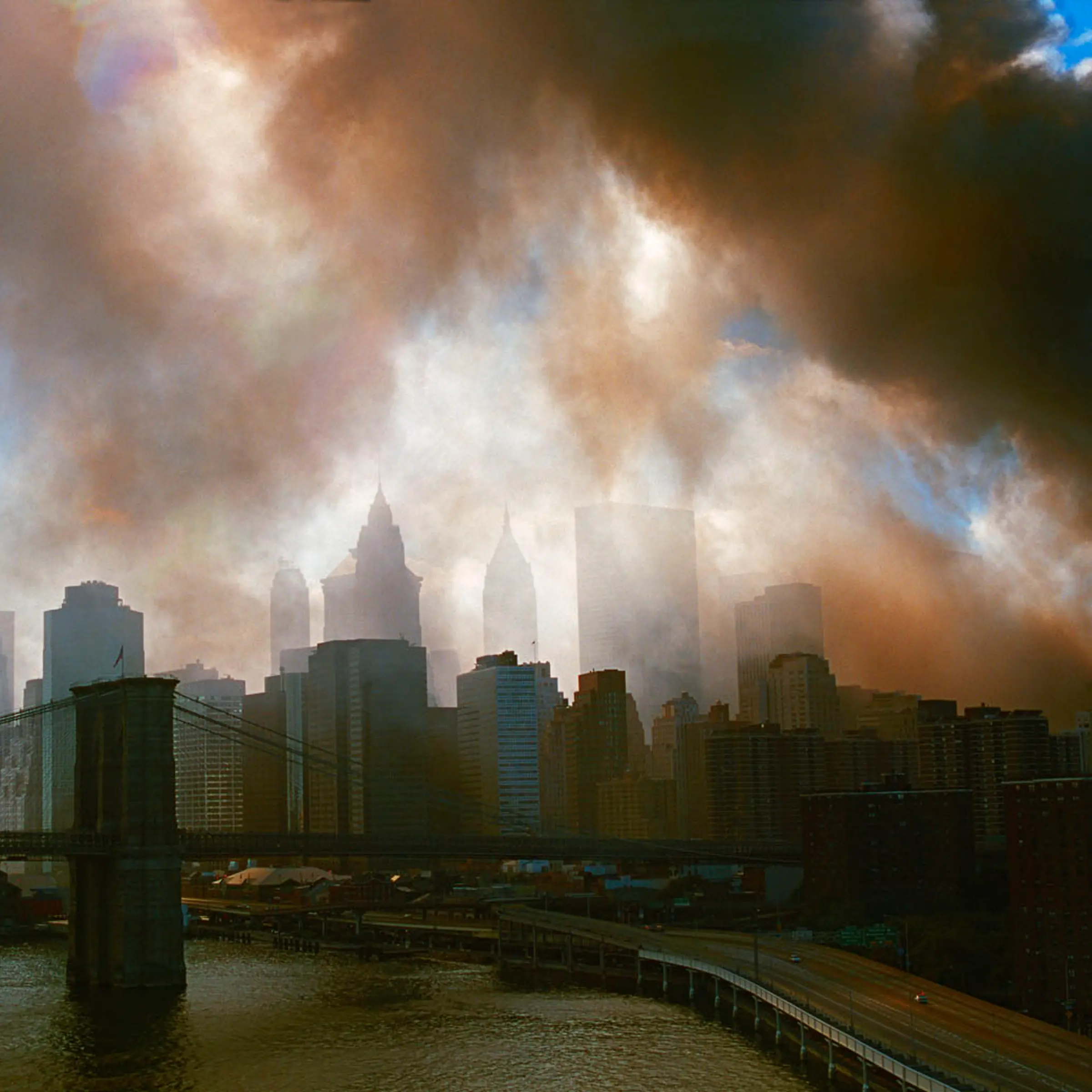 New York, NY, September 11, 2001. View from the Manhattan bridge towards the Brooklyn Bridge and downtown Manhattan during the aftermath of World Trade Center attacks.