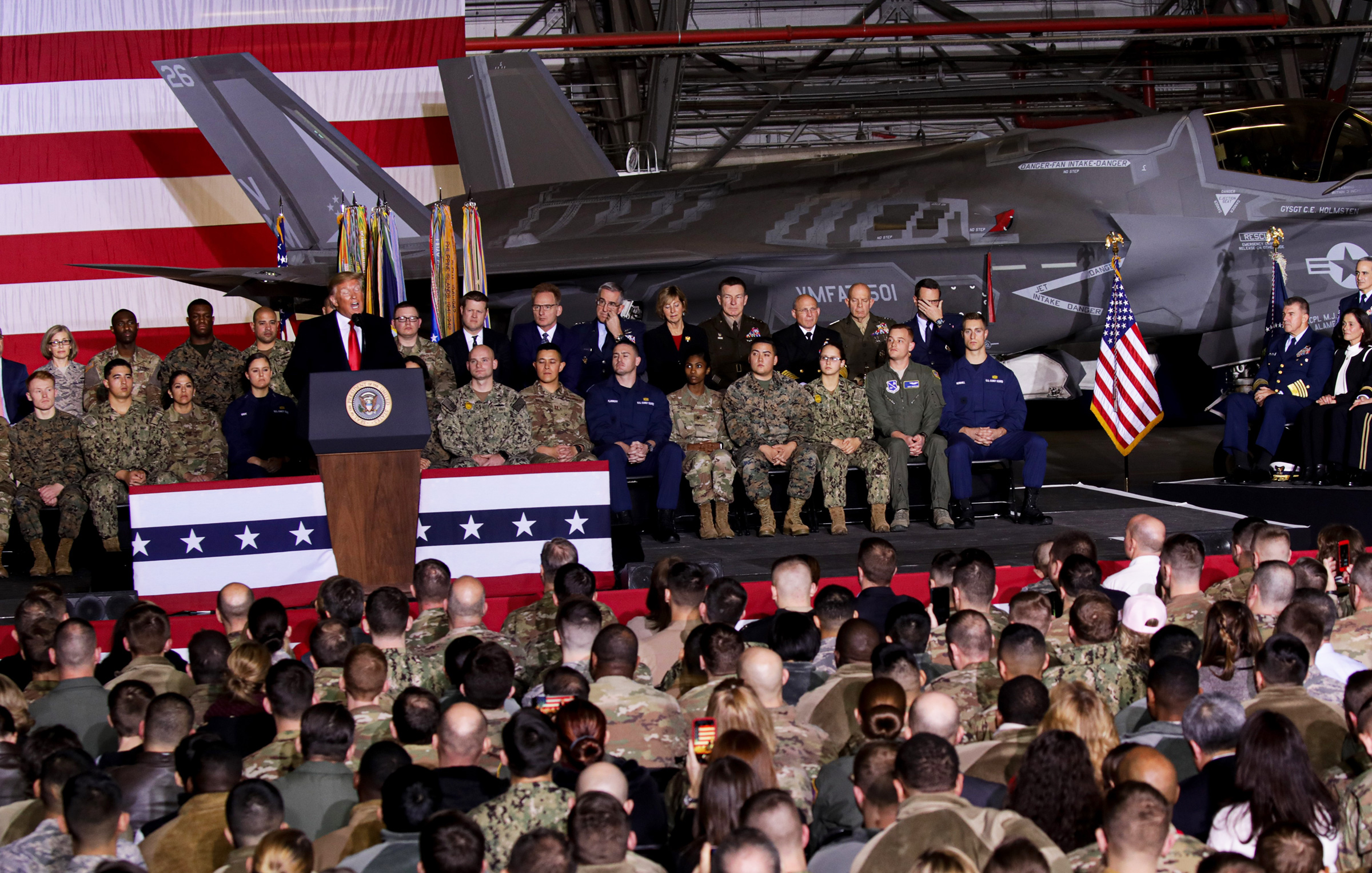 President Donald Trump makes a speech as he attends a signing ceremony at Joint Base Andrews