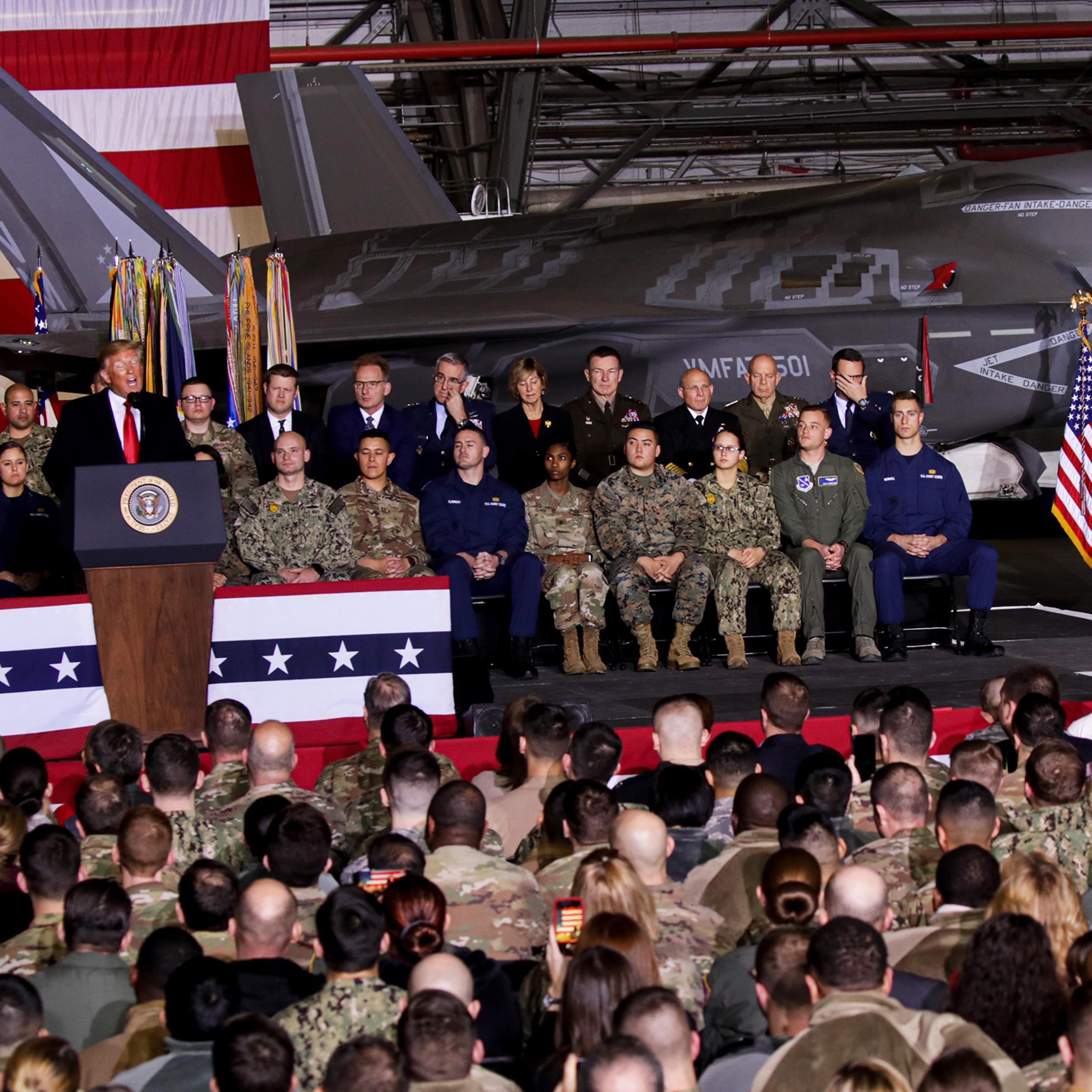 President Donald Trump makes a speech as he attends a signing ceremony at Joint Base Andrews