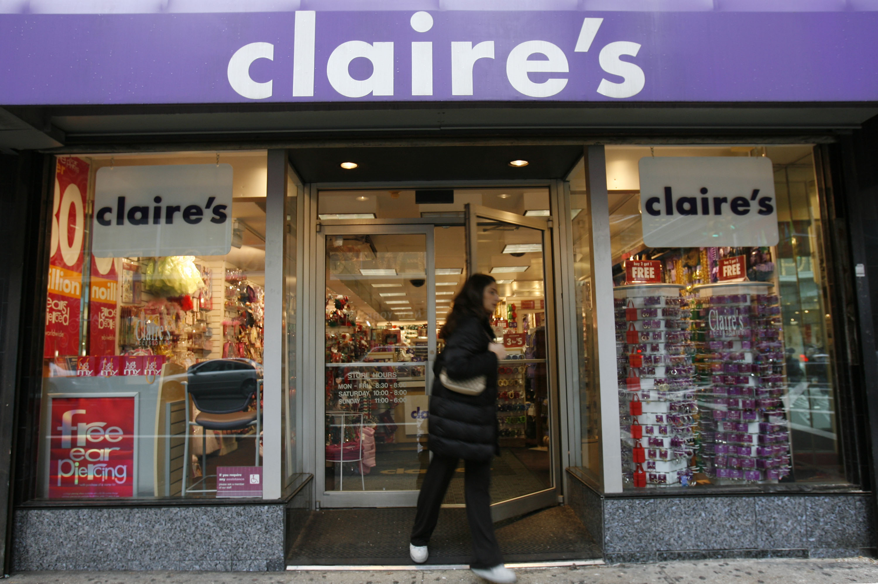A woman exits a Claire's store on Friday, December 1, 2006 i