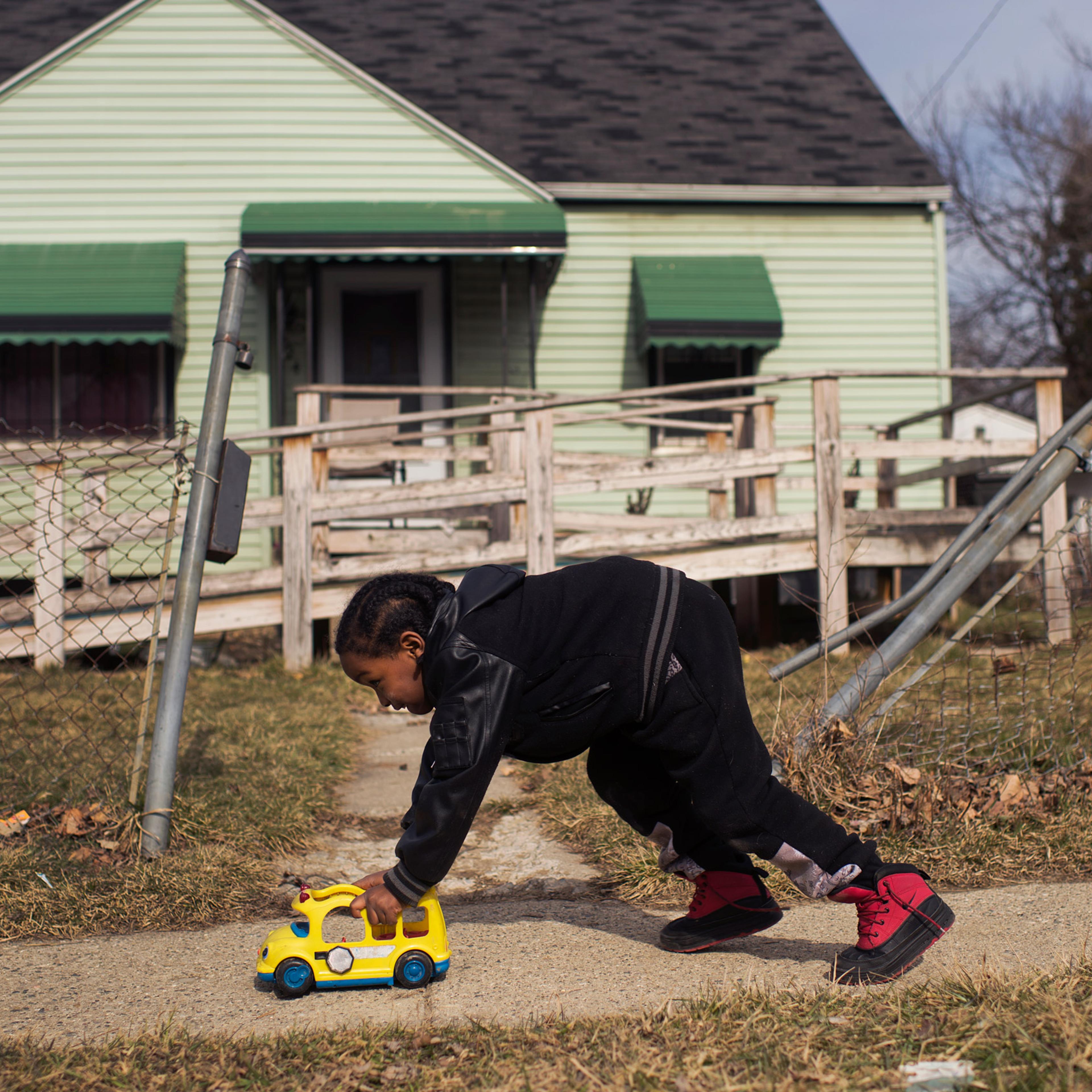 UNITED STATES - FEBRUARY 23: Davarious Griffin, 5, who has had elevated levels of lead detected in his blood, plays outside of his house on Ridgeway Avenue in Flint, Mich., February 23, 2016. The water supply was not properly treated after being switched