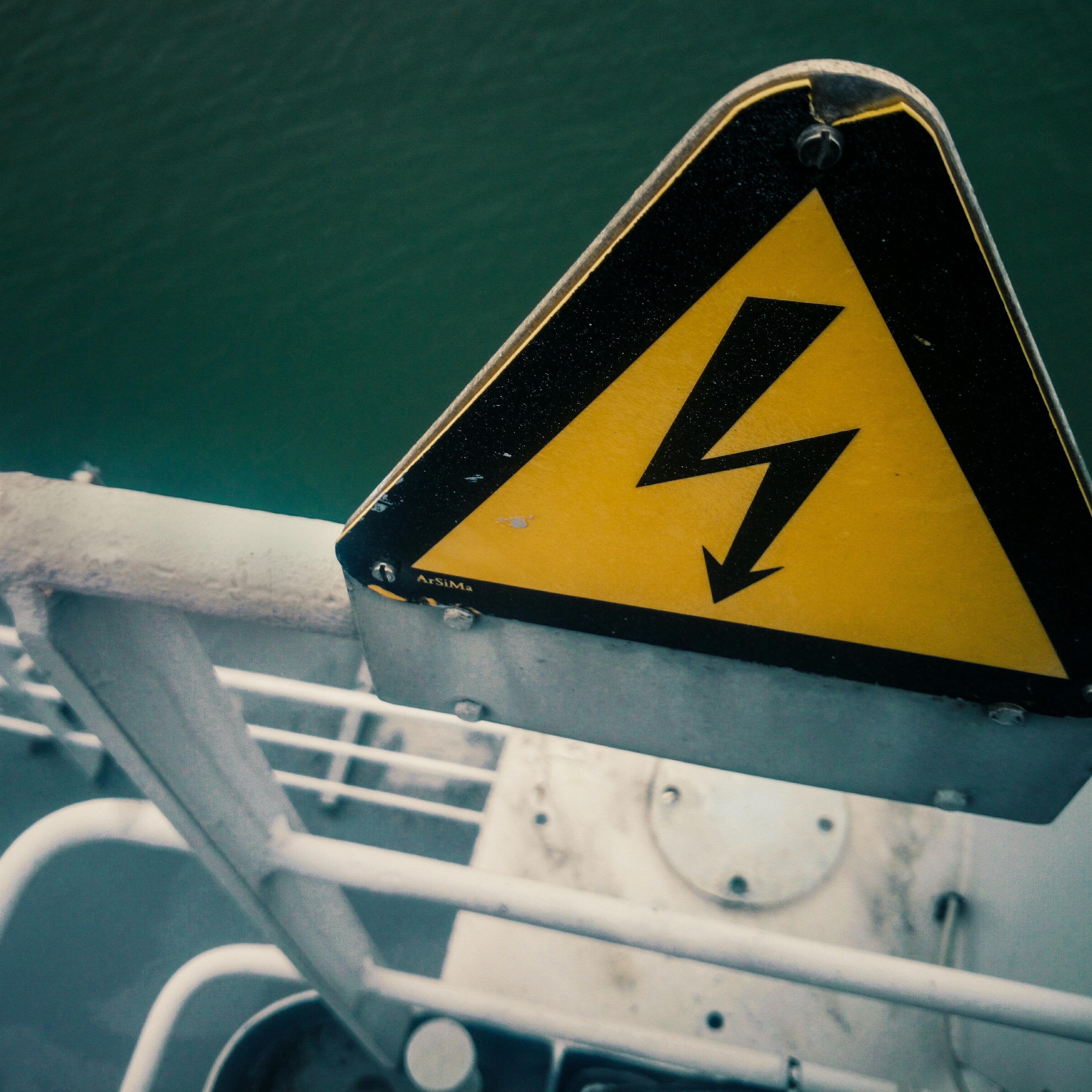 High Angle View Of High Voltage Sign On Ship