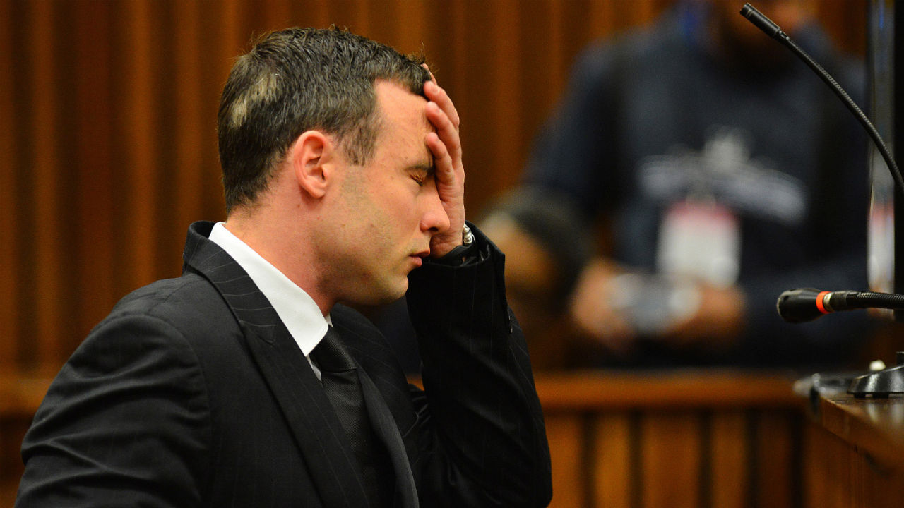 Oscar Pistorius listens to evidence in the Pretoria High Court on June 30, 2014, in Pretoria, South Africa. Oscar Pistorius stands accused of the murder of his girlfriend, Reeva Steenkamp, on February 14, 2013. This is Pistorius' official trial, the result of which will determine the paralympian athlete's fate. 