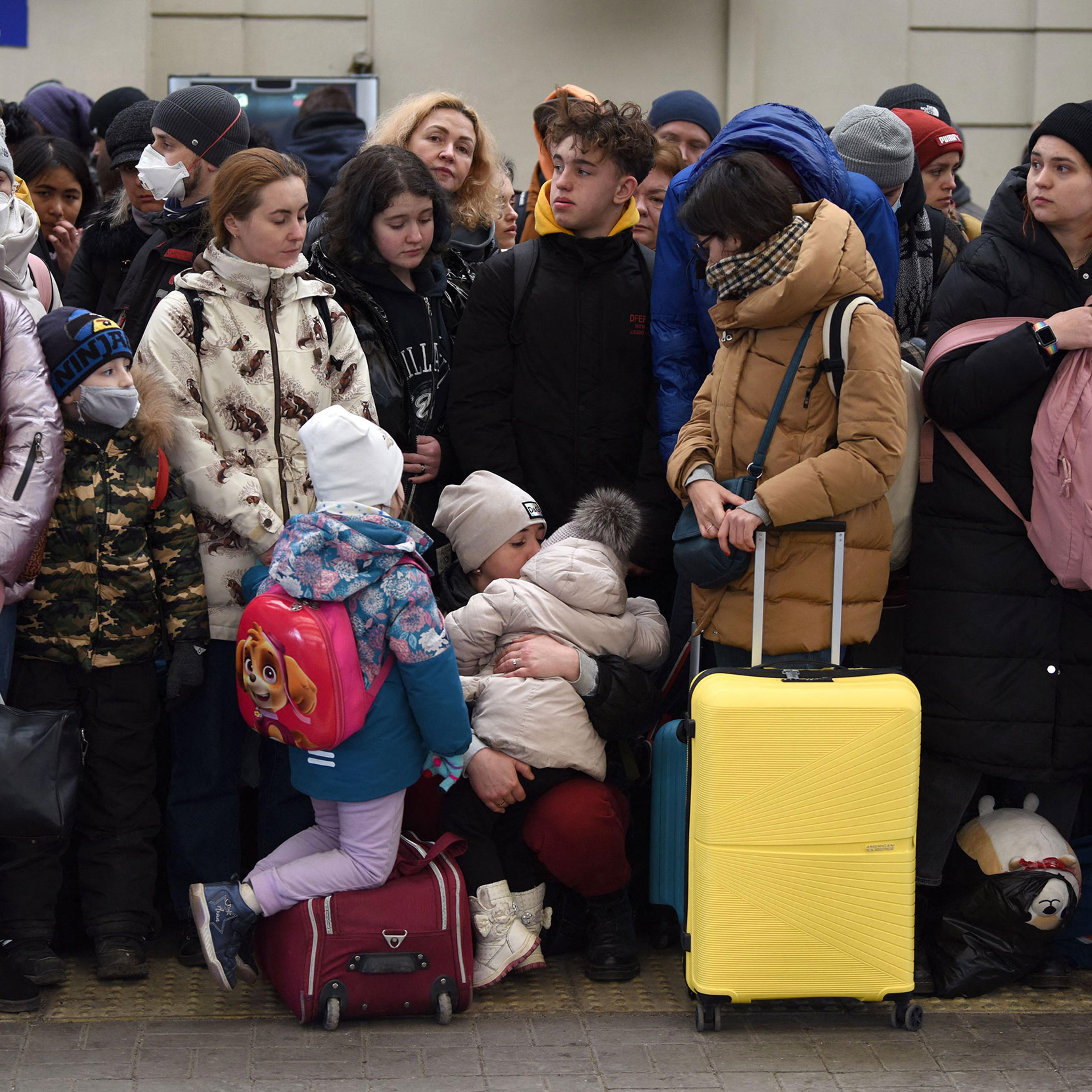 People wait for a train to Poland at the railway station of the western Ukrainian city of Lviv on Feb. 26.