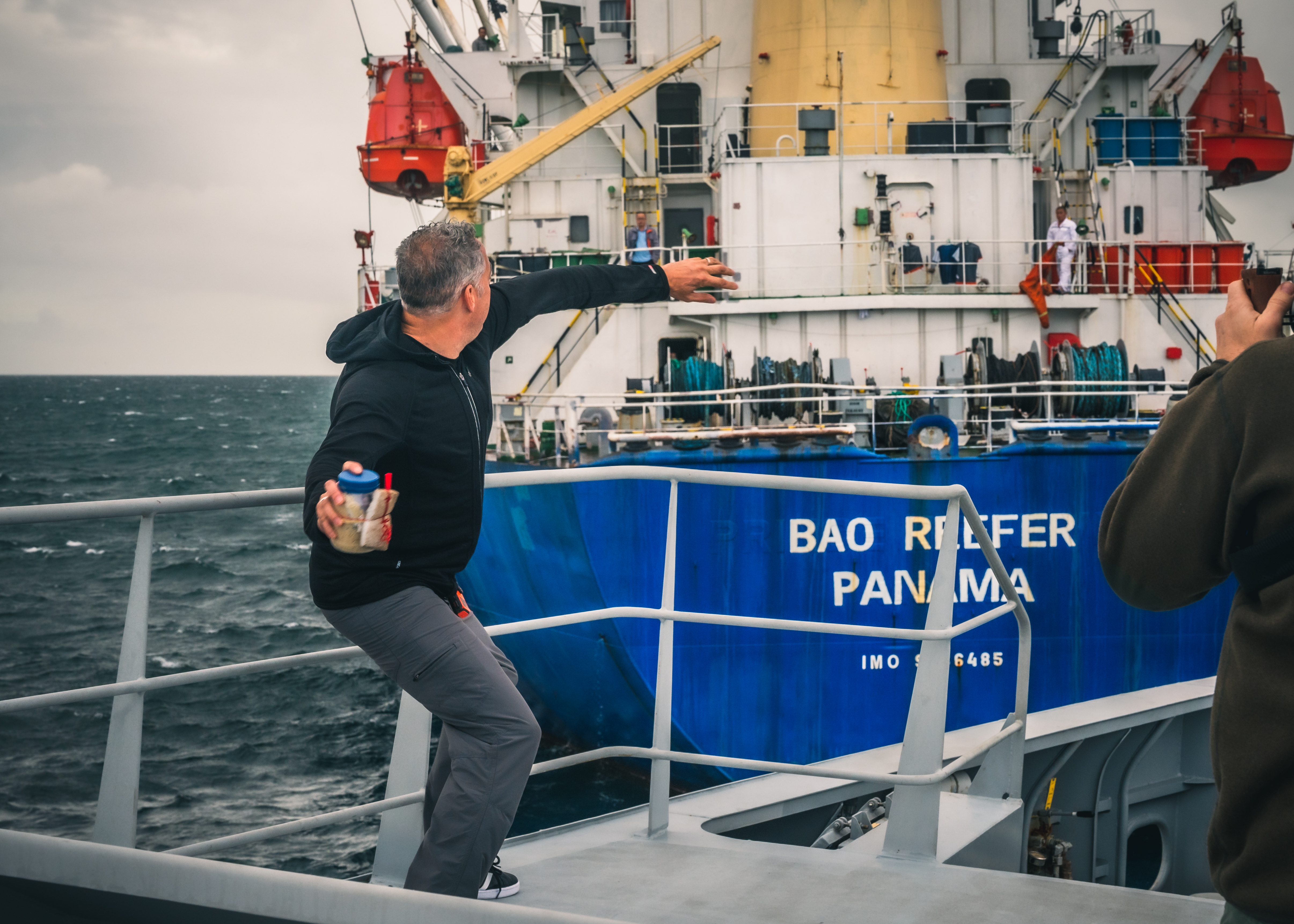 Ian Urbina throw bottle with message to Bao Reefer