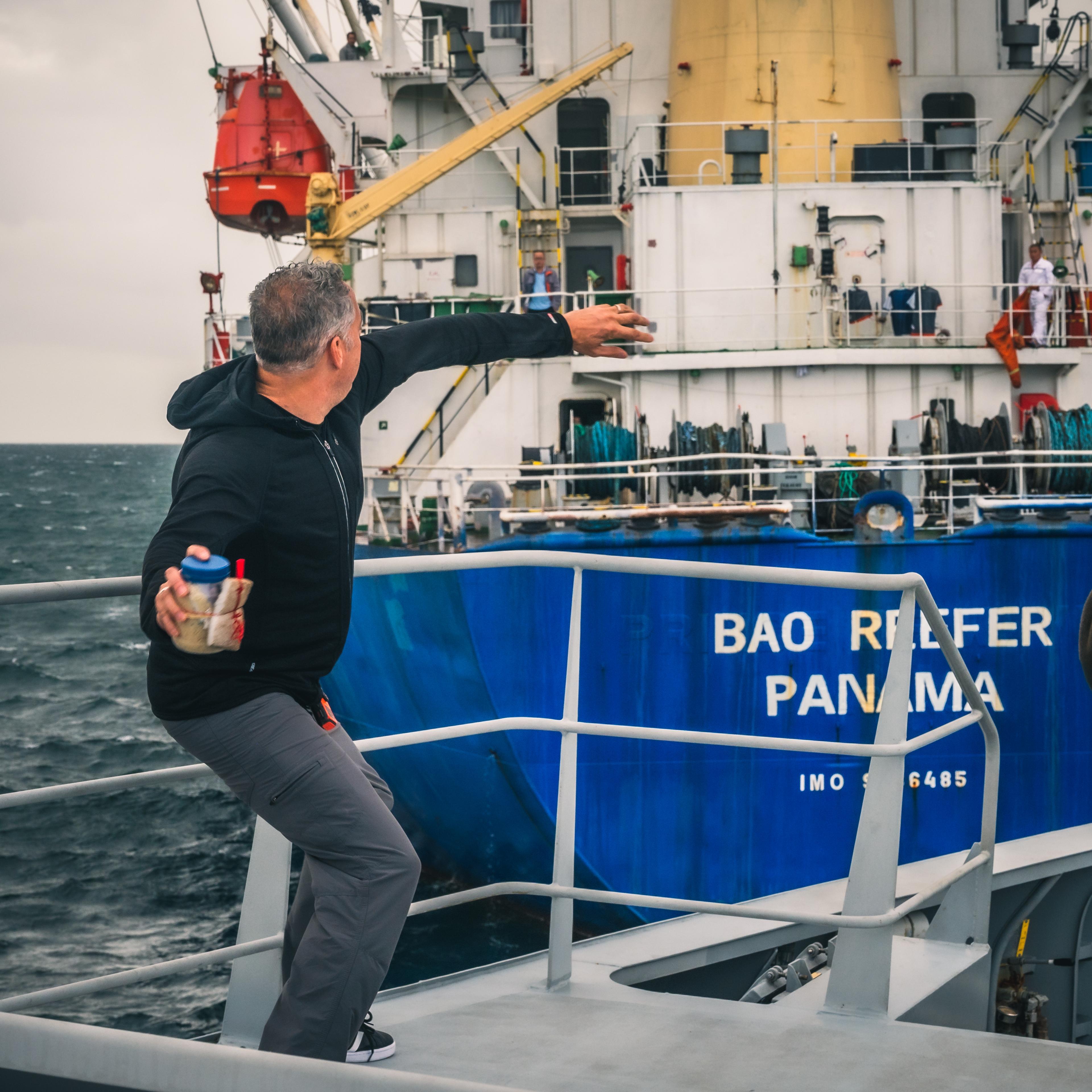 Ian Urbina throw bottle with message to Bao Reefer