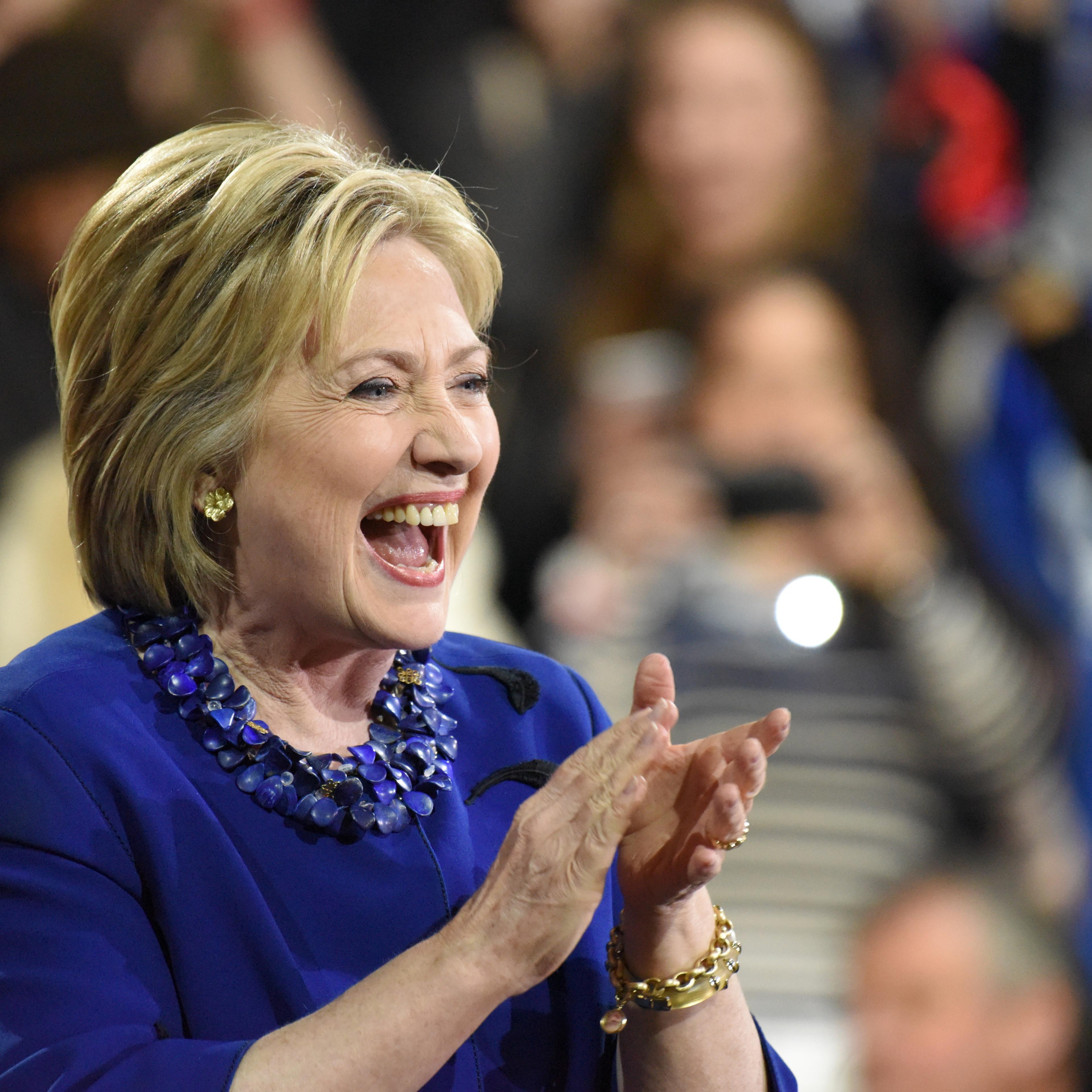 Clinton laughs during remarks spot-lighting her Super Tuesday victory.