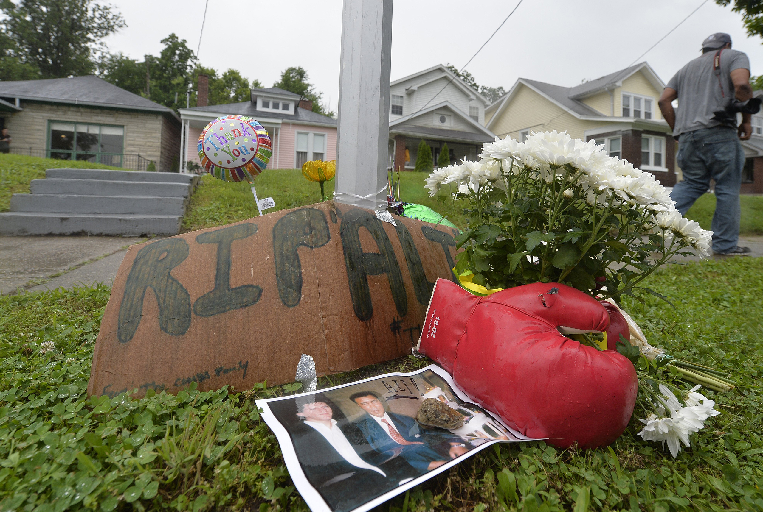 A small memorial sits in front of the boyhood home of Muhammad Ali in Louisville, Kentucky, June 4, 2016.