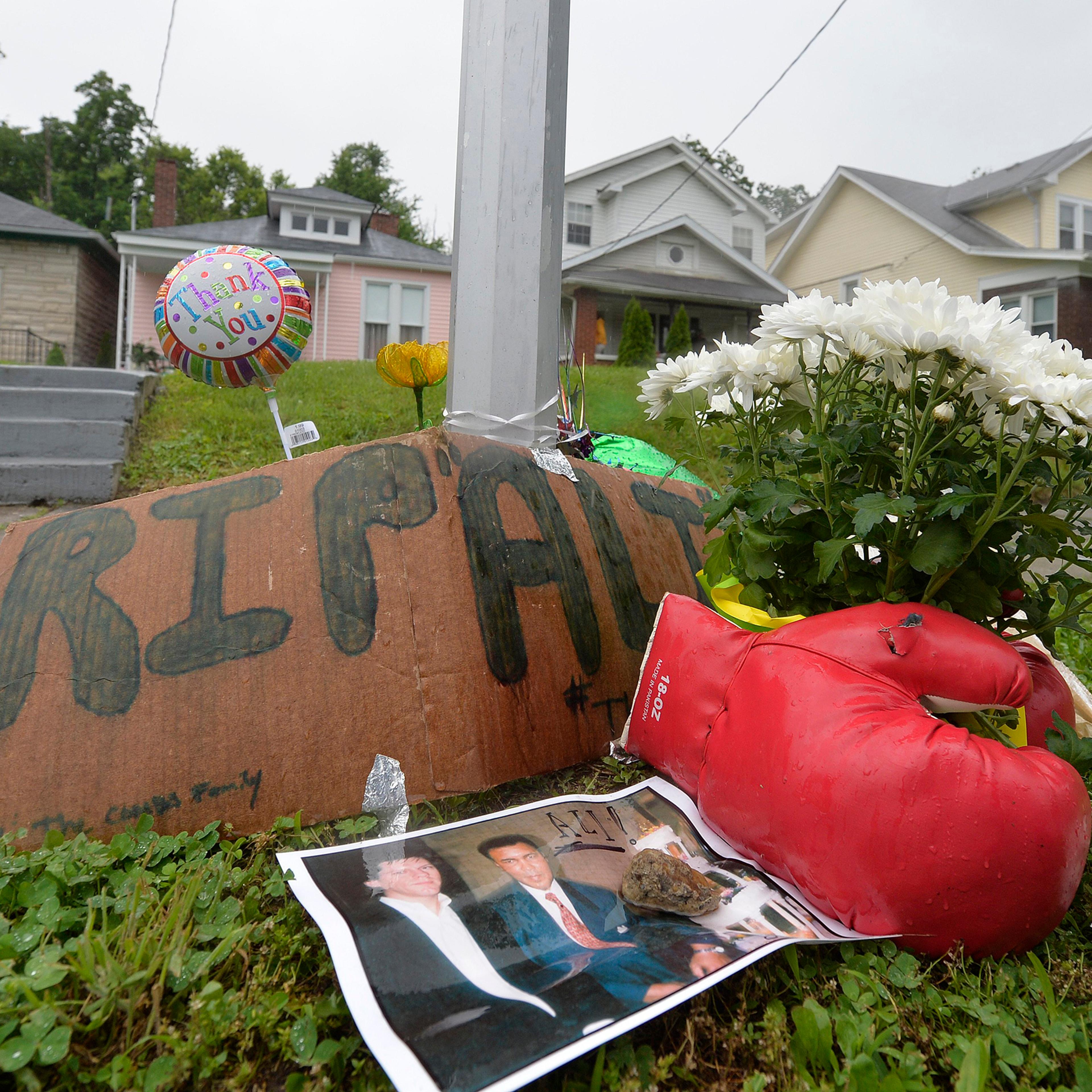 A small memorial sits in front of the boyhood home of Muhammad Ali in Louisville, Kentucky, June 4, 2016.
