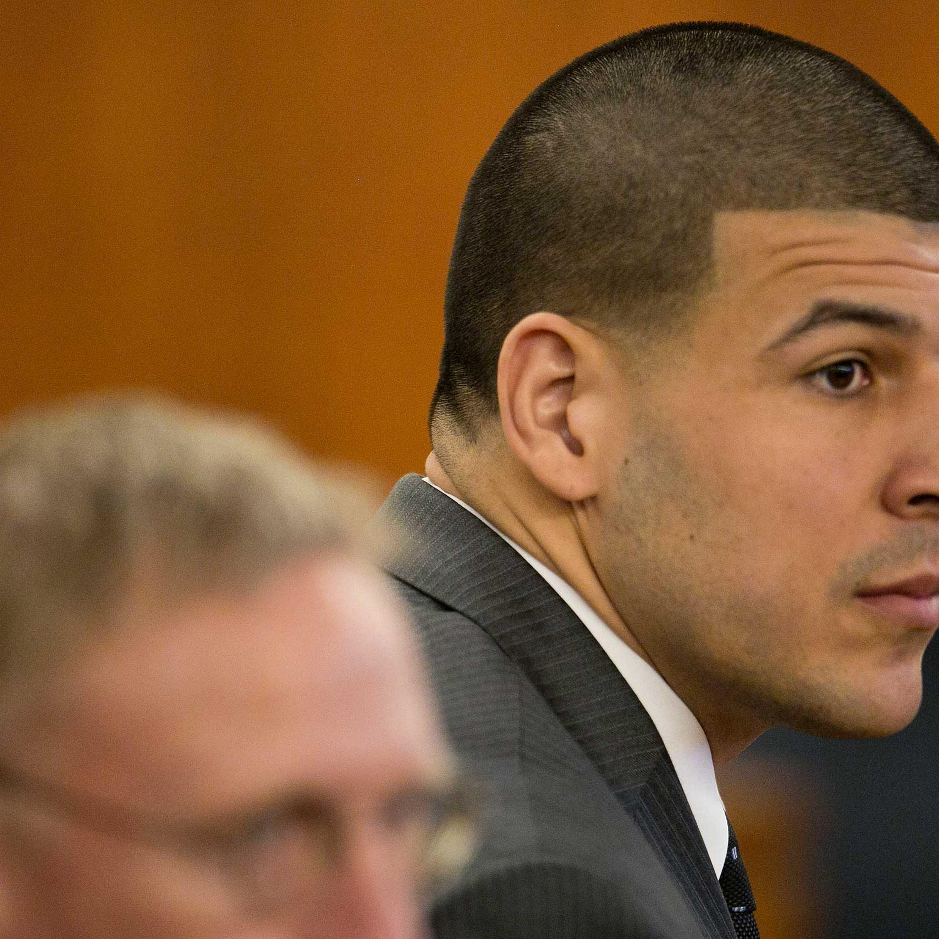 Former New England Patriots NFL football player Aaron Hernandez listens during his murder trial at the Bristol County Superior Court in Fall River, Mass., on Wednesday, April 15, 2015. Hernandez is accused of killing Odin Lloyd in June 2013. (Dominick Re