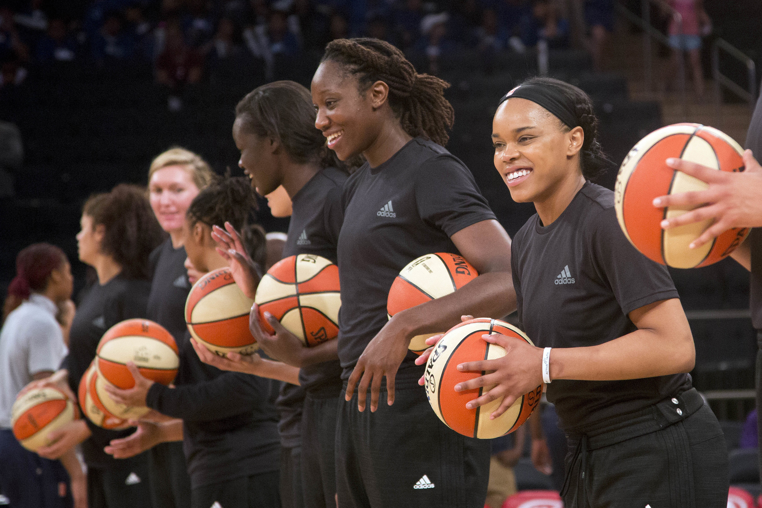 Members of the New York Liberty basketball team await the start of a game against the Atlanta Dream in New York City on July 13, 2016.