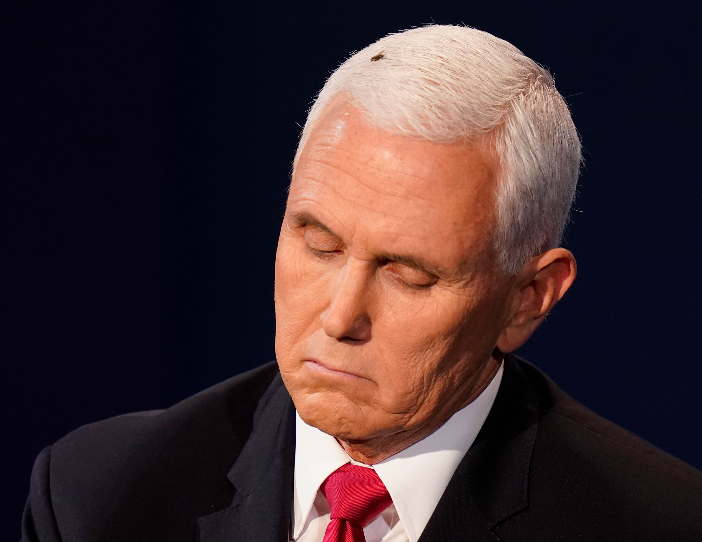 Vice President Mike Pence listens to Democratic vice presidential candidate Sen. Kamala Harris during the vice presidential debate on Oct. 7, 2020, in Utah in Salt Lake City.