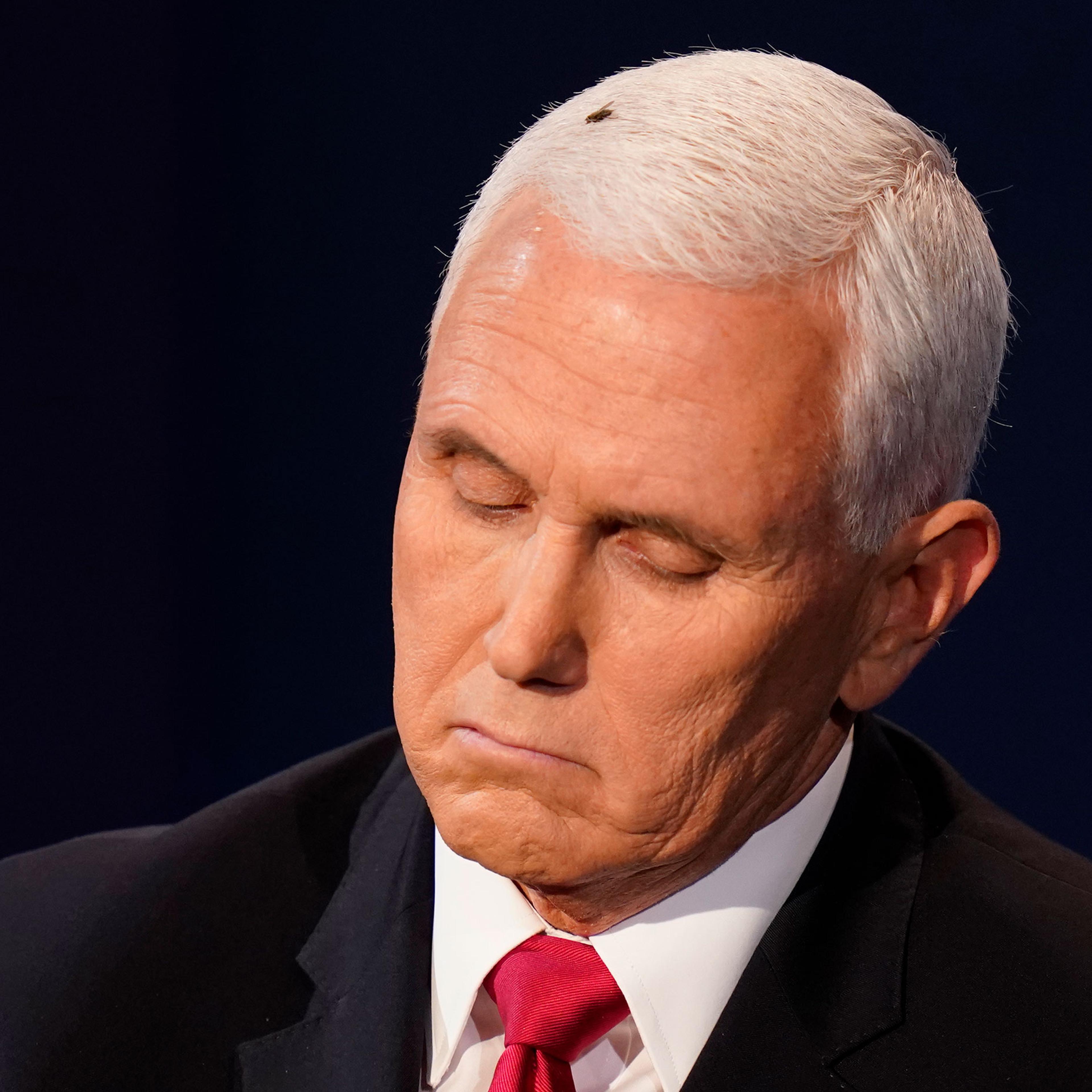 Vice President Mike Pence listens to Democratic vice presidential candidate Sen. Kamala Harris during the vice presidential debate on Oct. 7, 2020, in Utah in Salt Lake City.