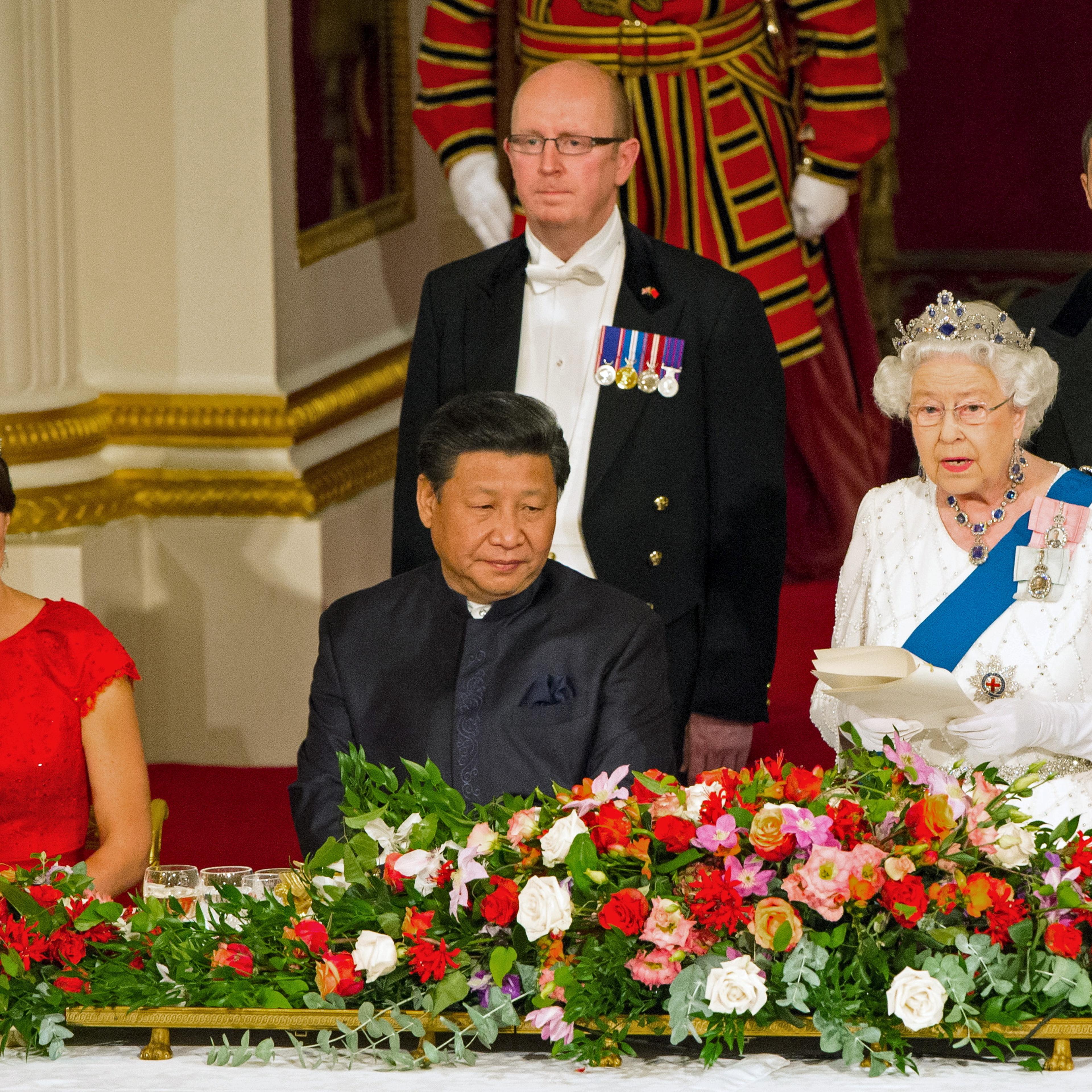 The Duchess of Cambridge and Chinese President Xi Jinping listen as Queen Elizabeth II speaks at a state banquet at Buckingham Palace, London, during the first day of his state visit to Britain
