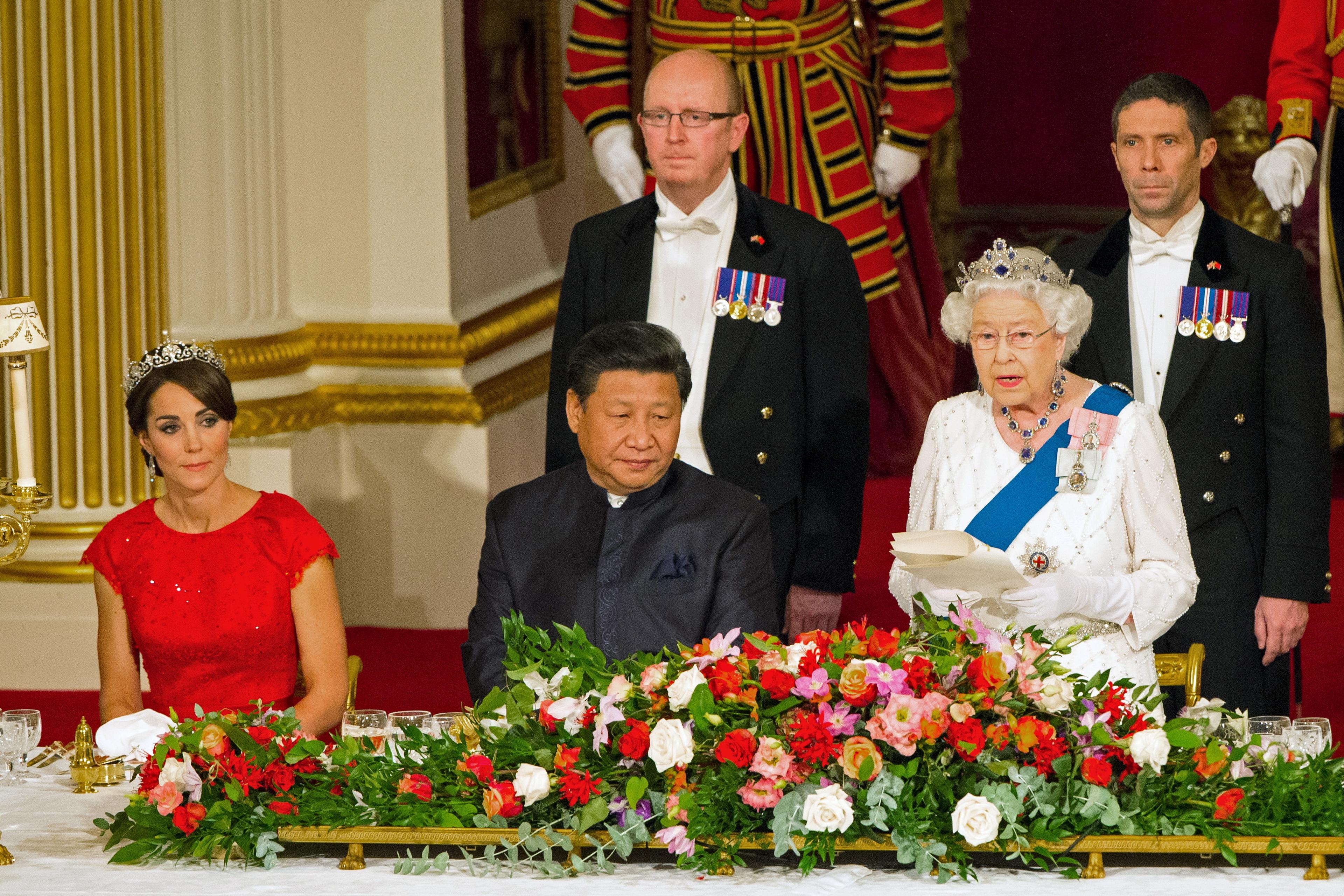The Duchess of Cambridge and Chinese President Xi Jinping listen as Queen Elizabeth II speaks at a state banquet at Buckingham Palace, London, during the first day of his state visit to Britain