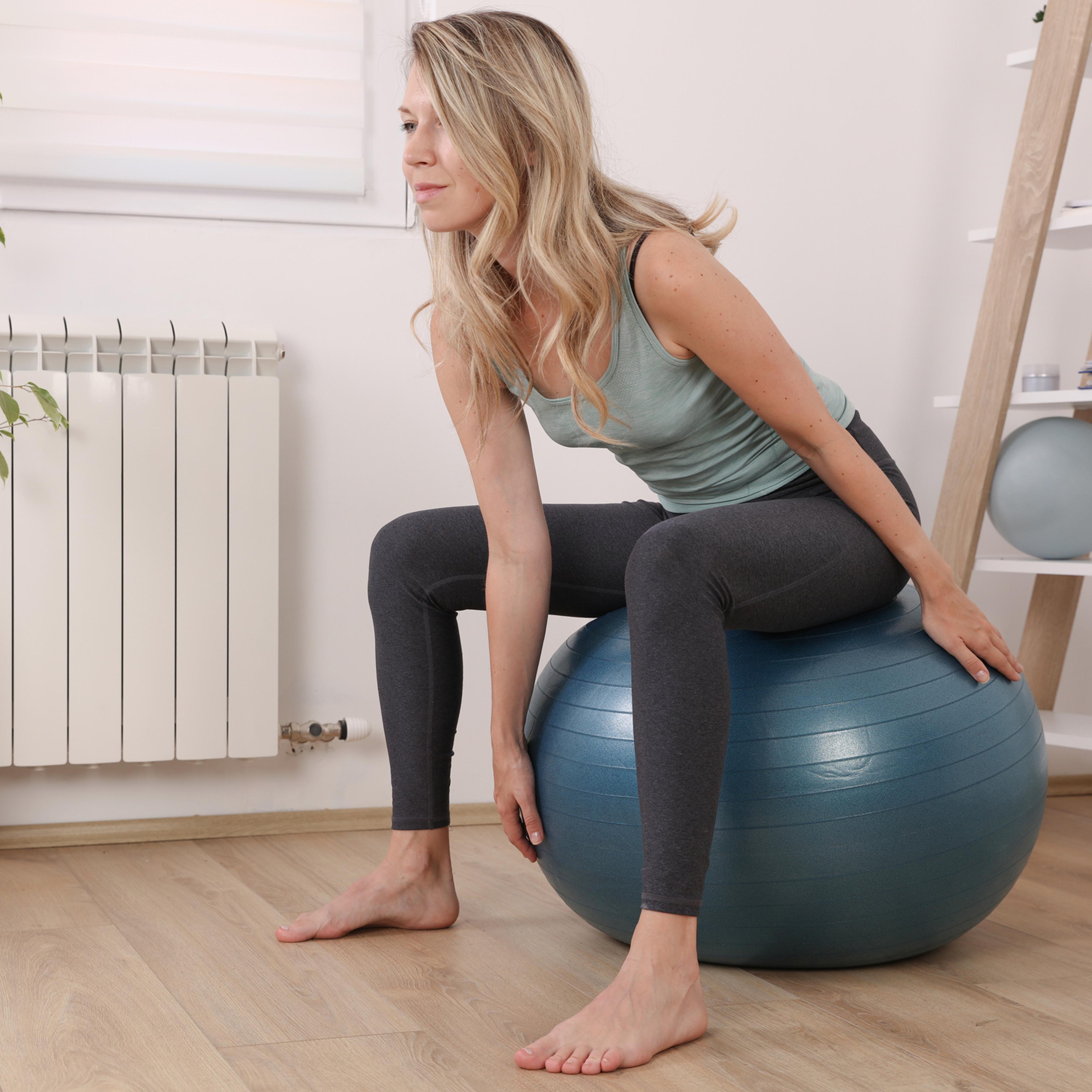 Pilates workout for women, physiotherapy. Female workout with fitness ball, balance and breathing exercises