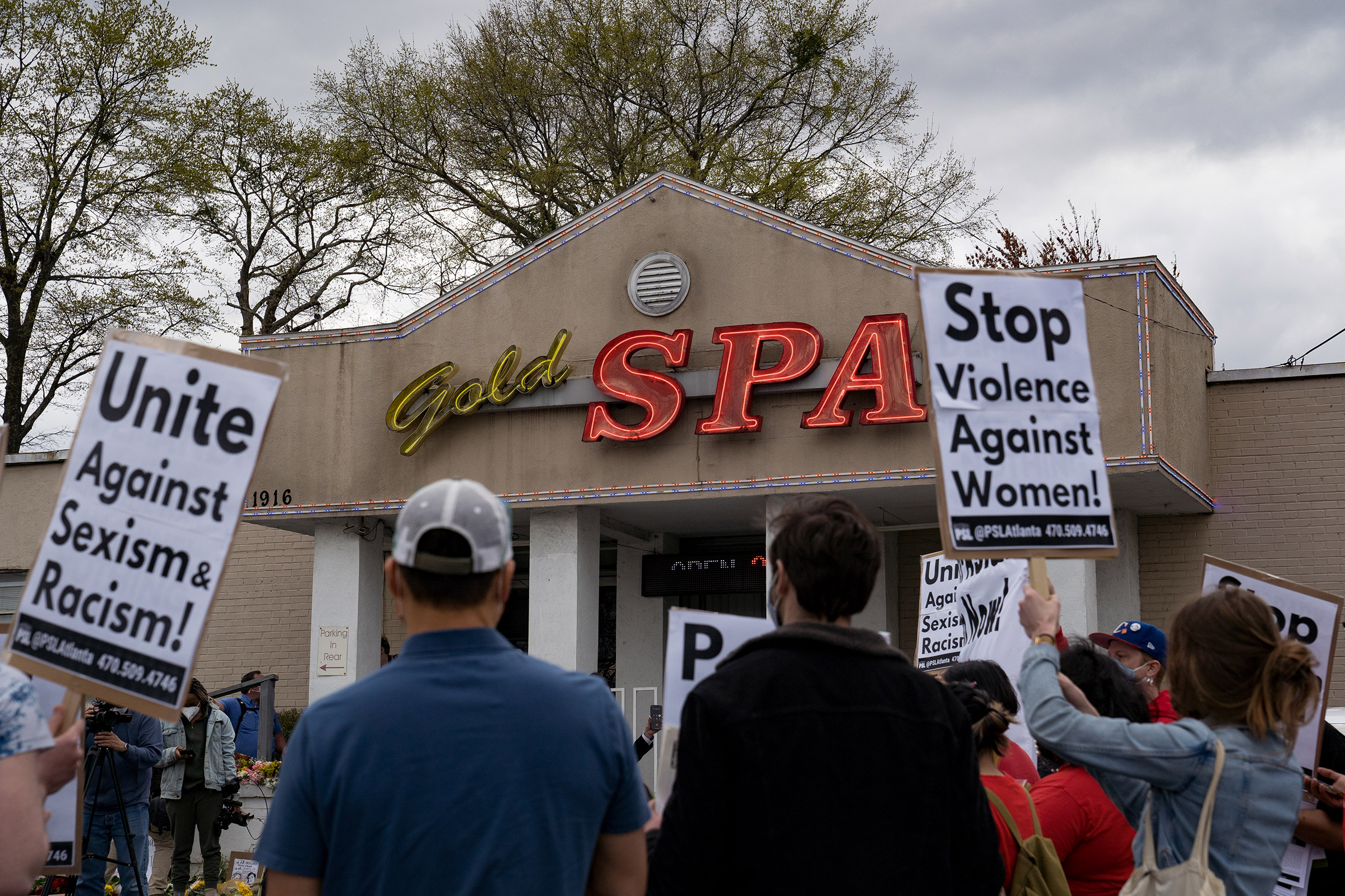 Activists demonstrate outside Gold Spa following Tuesday night's shooting, in Atlanta, Ga., on March 18, 2021.