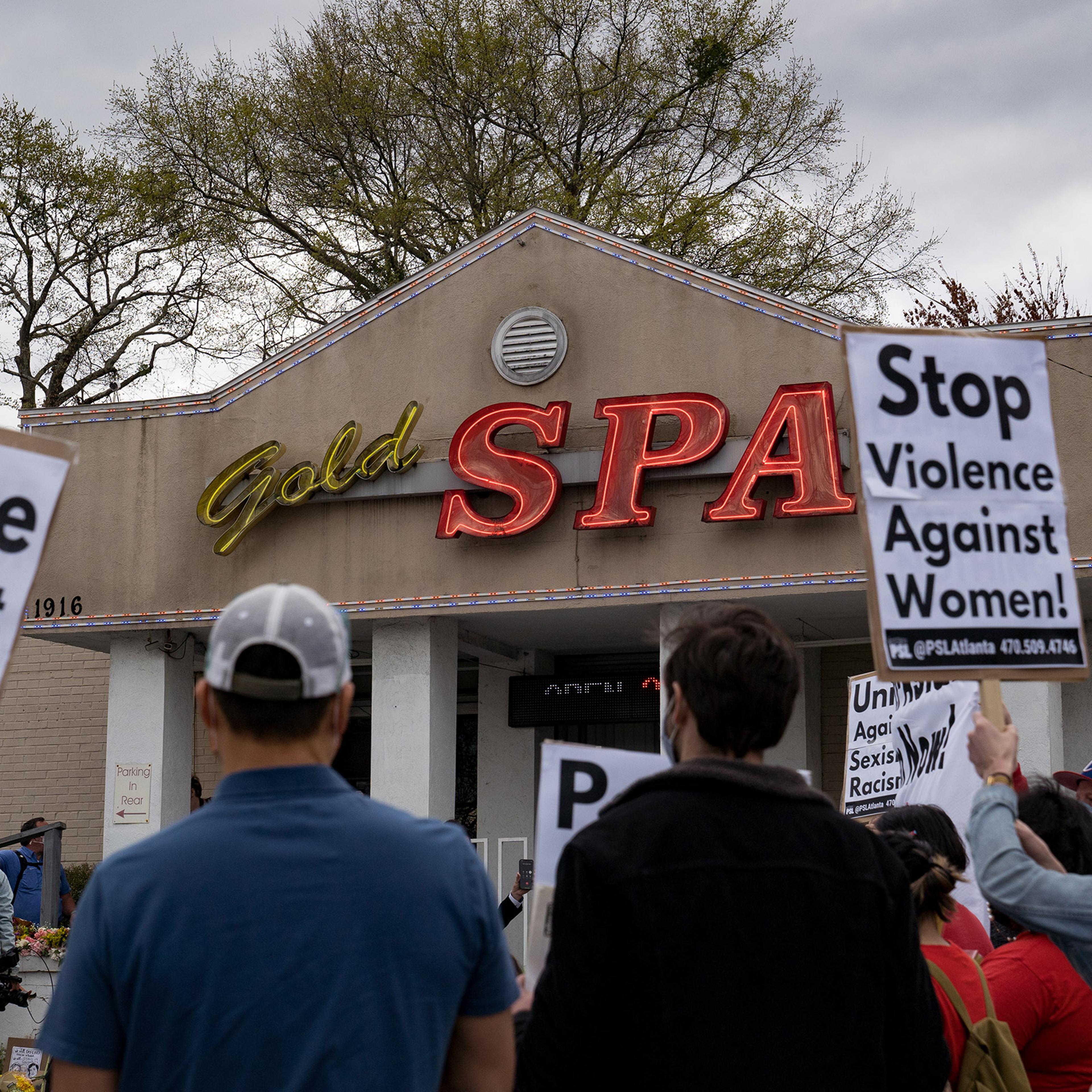 Activists demonstrate outside Gold Spa following Tuesday night's shooting, in Atlanta, Ga., on March 18, 2021.