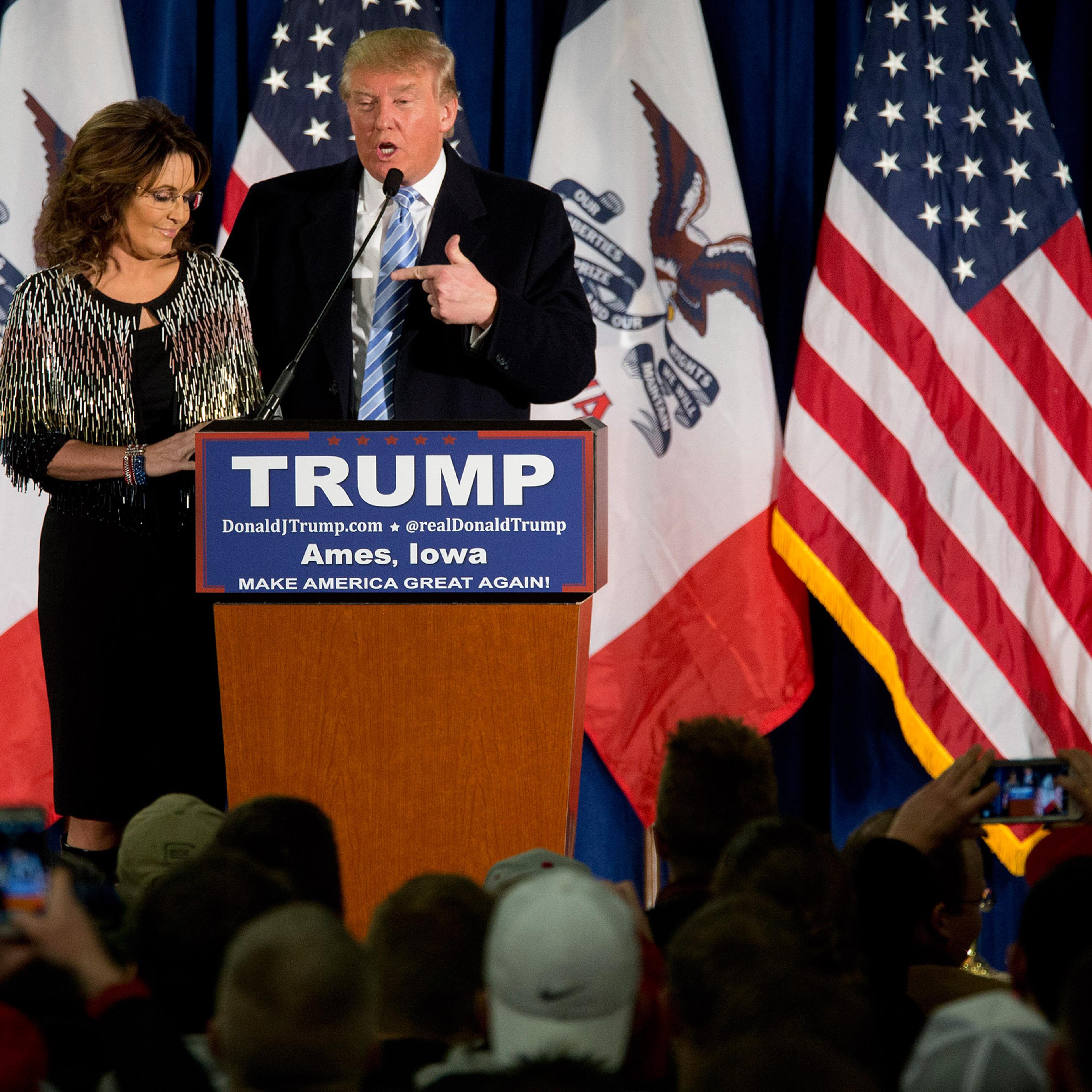 Former Alaska Gov. Sarah Palin, left, endorses Republican presidential candidate Donald Trump during a rally at the Iowa State University, Tuesday, Jan. 19, 2016, in Ames, Iowa. (AP Photo/Mary Altaffer)