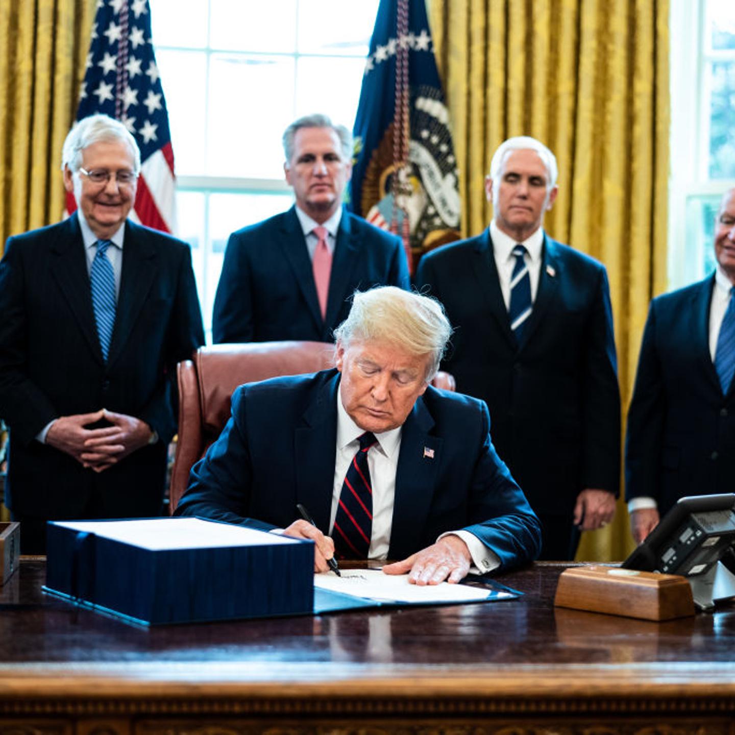 President Trump Signs Coronavirus Stimulus Bill In The Oval Office