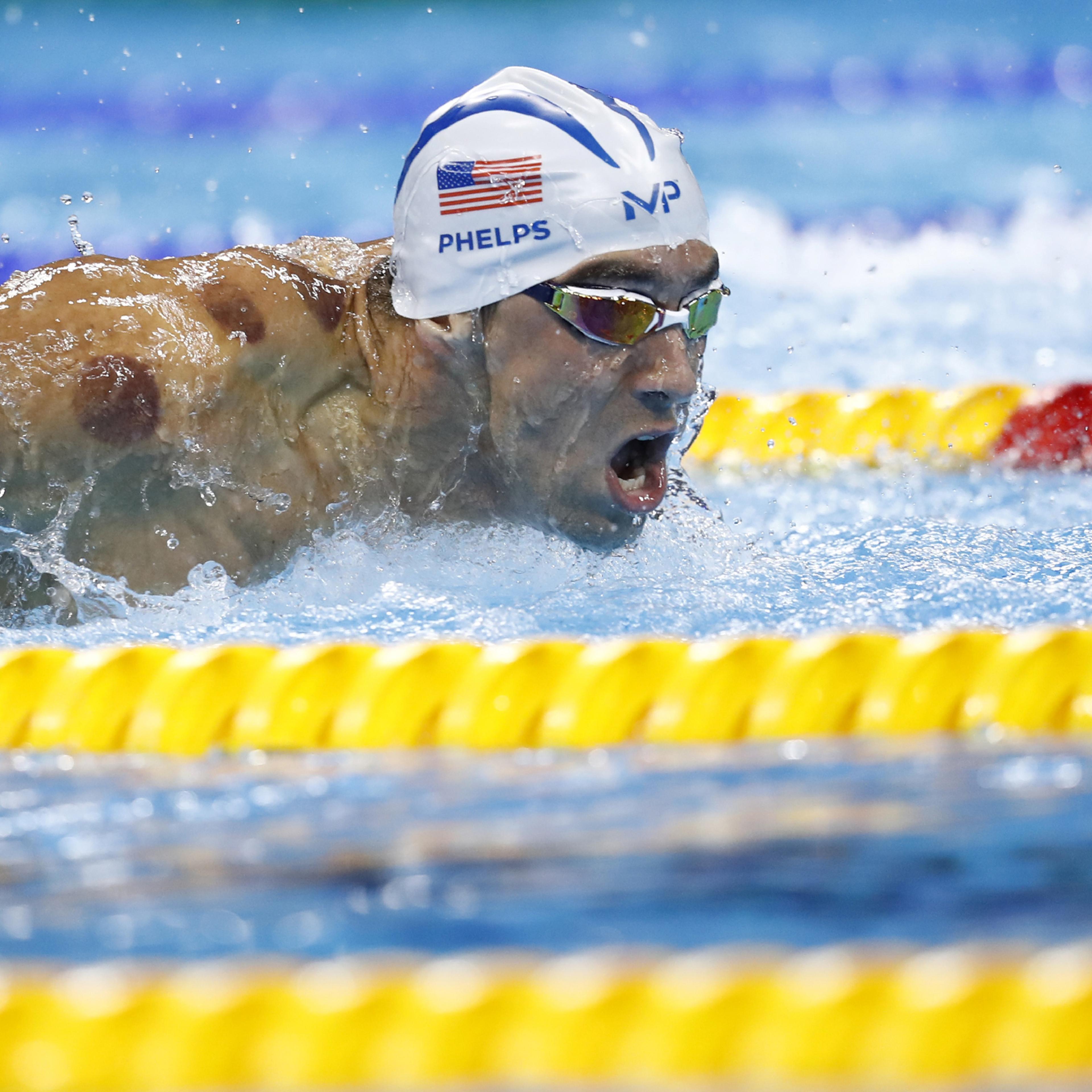USA's Michael Phelps competes in a Men's 200m Butterfly heat during the swimming event at the Rio 2016 Olympic Games at the Olympic Aquatics Stadium in Rio de Janeiro on August 8, 2016. / AFP / Odd Andersen (Photo credit should read ODD ANDERSEN/AFP/Gett