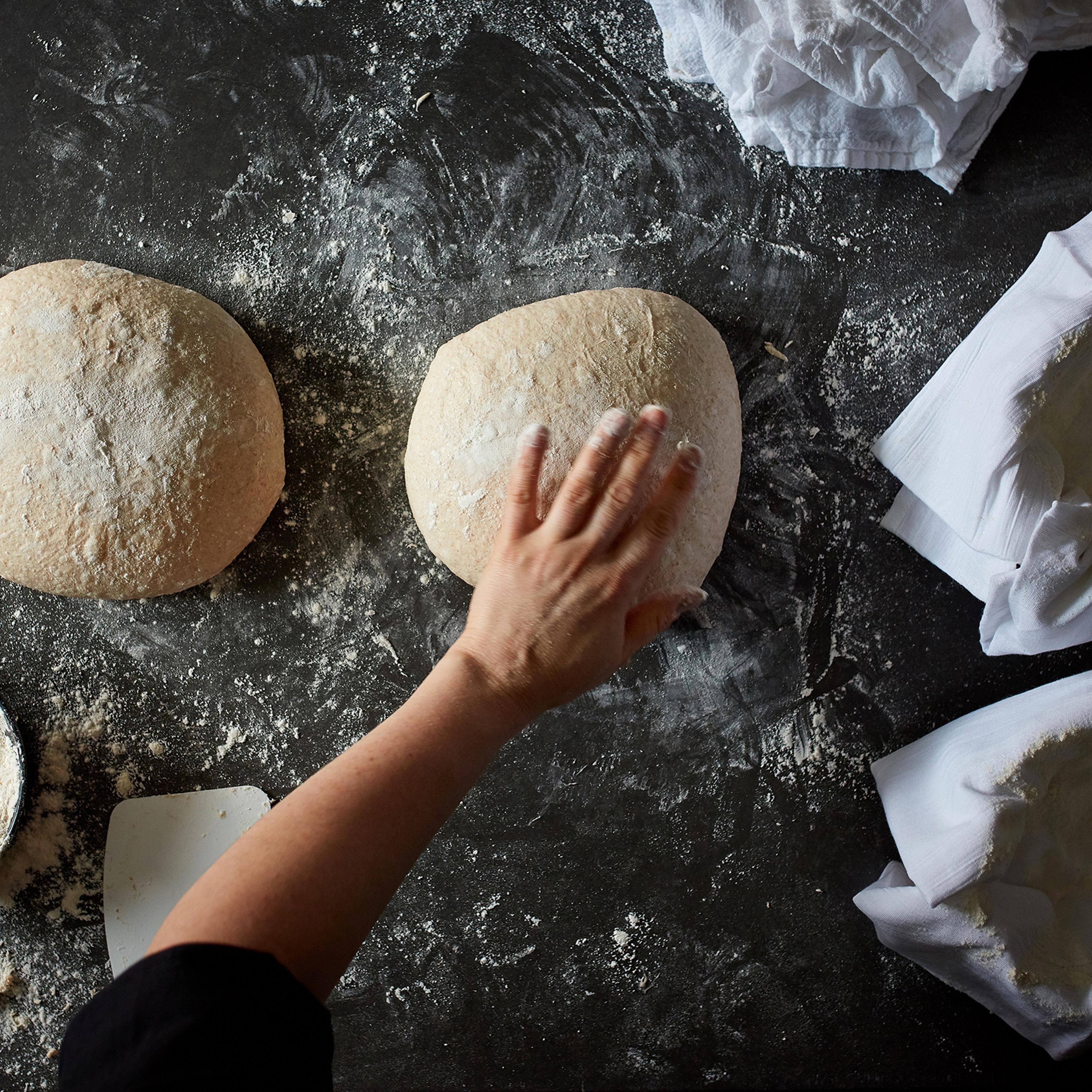 Dough is shaped for sourdough bread in New York, Sept. 10, 2019. Food Stylist: Laurie Pellicano. (Johnny Miller/The New York Times