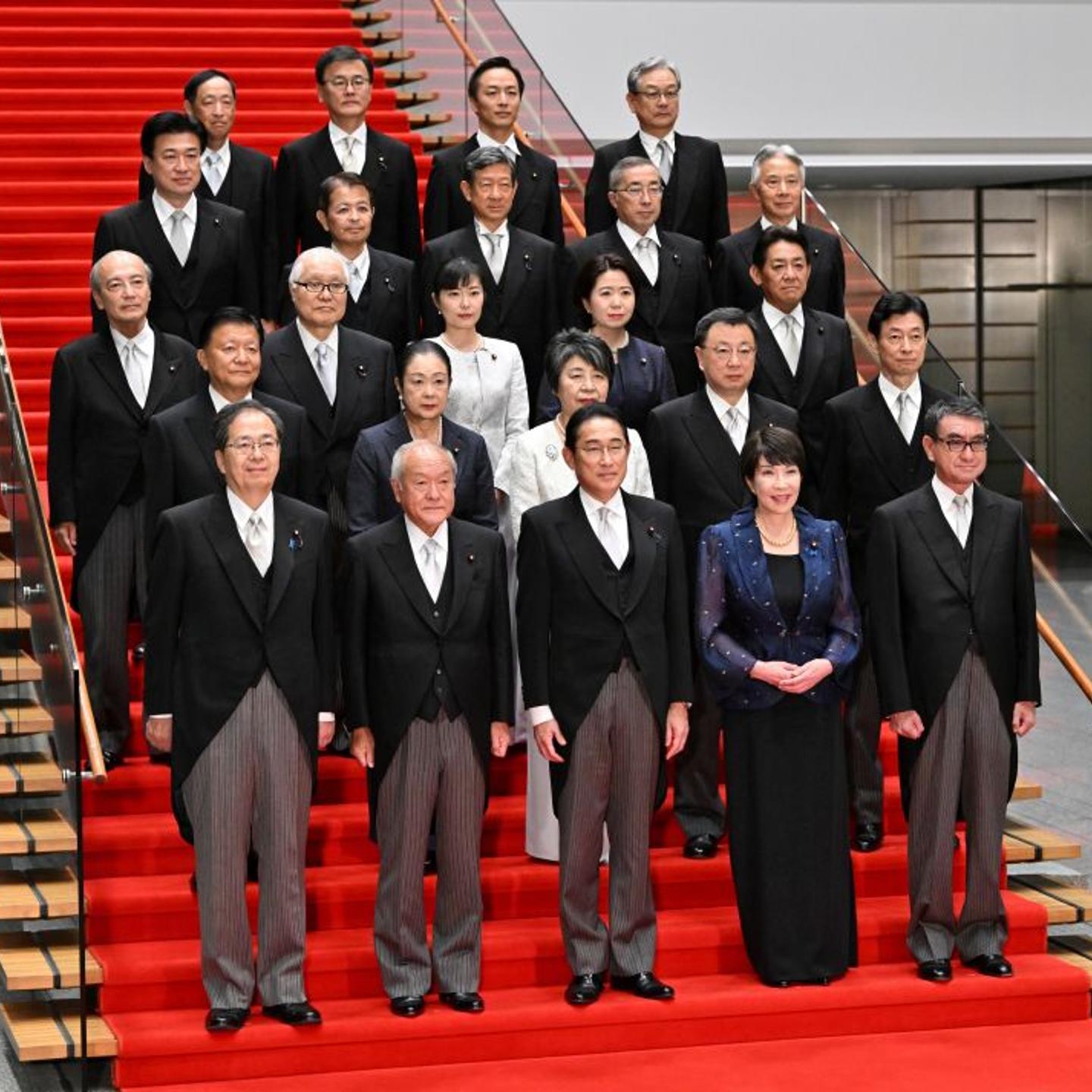 Japanese Prime Minister Fumio Kishida (front-center) poses with new cabinet members at his official residence after new cabinet reshuffle, keeping in place some most influential members in Tokyo, Japan, on Sept. 13, 2023.