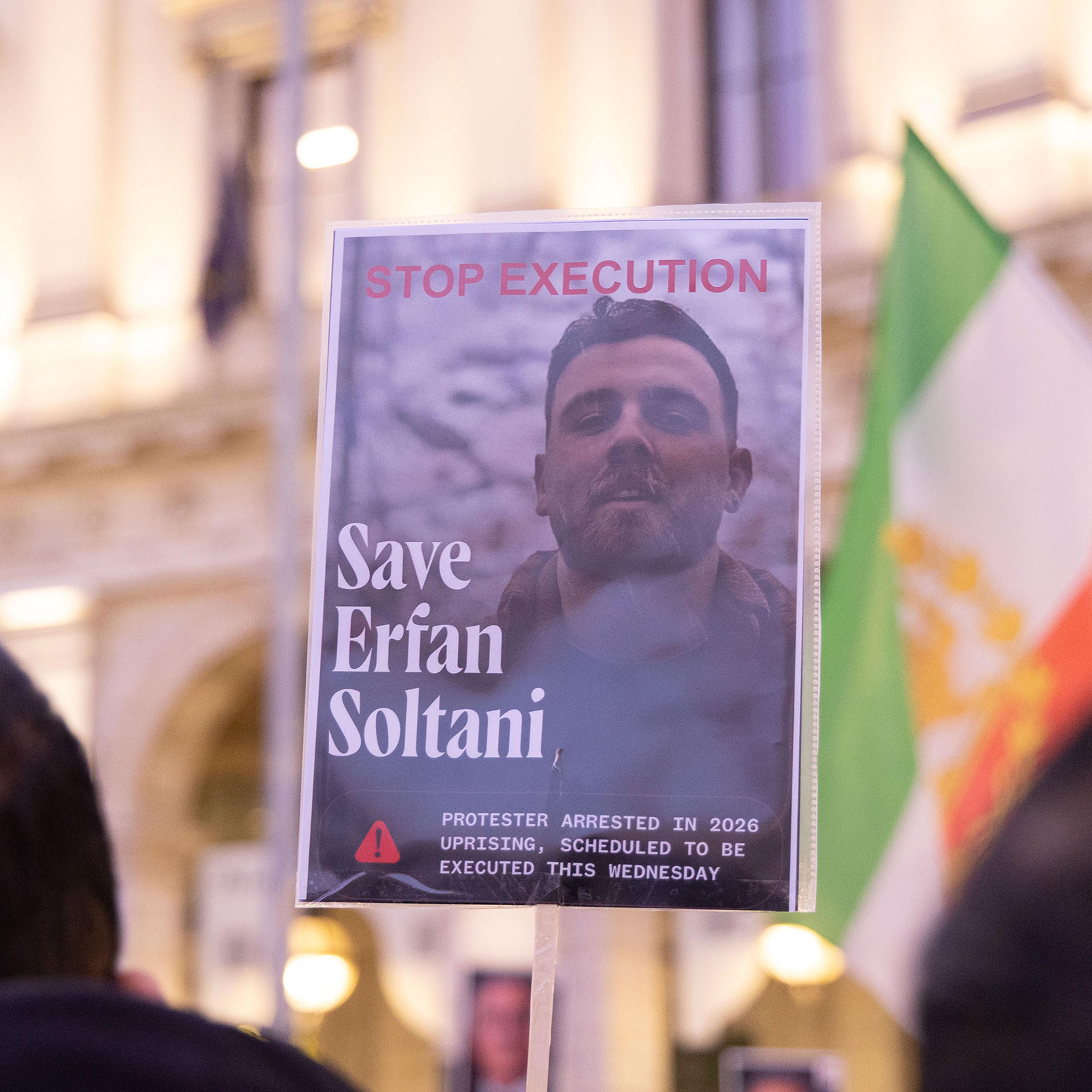 A signed, held by a protestor during a sit-in at the Piazza della Repubblica in Rome, showing Efran Soltani