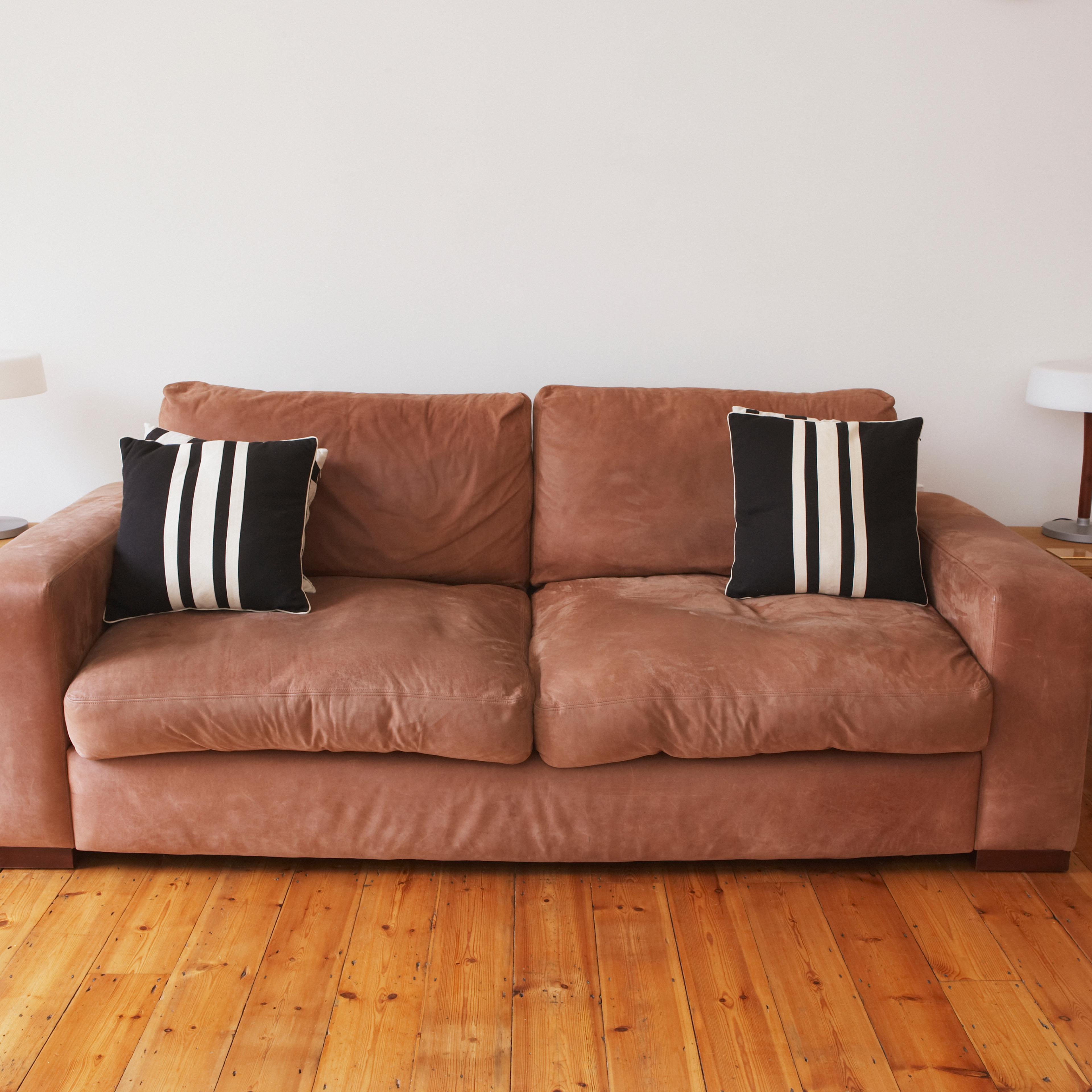 Empty living room with couch and end tables