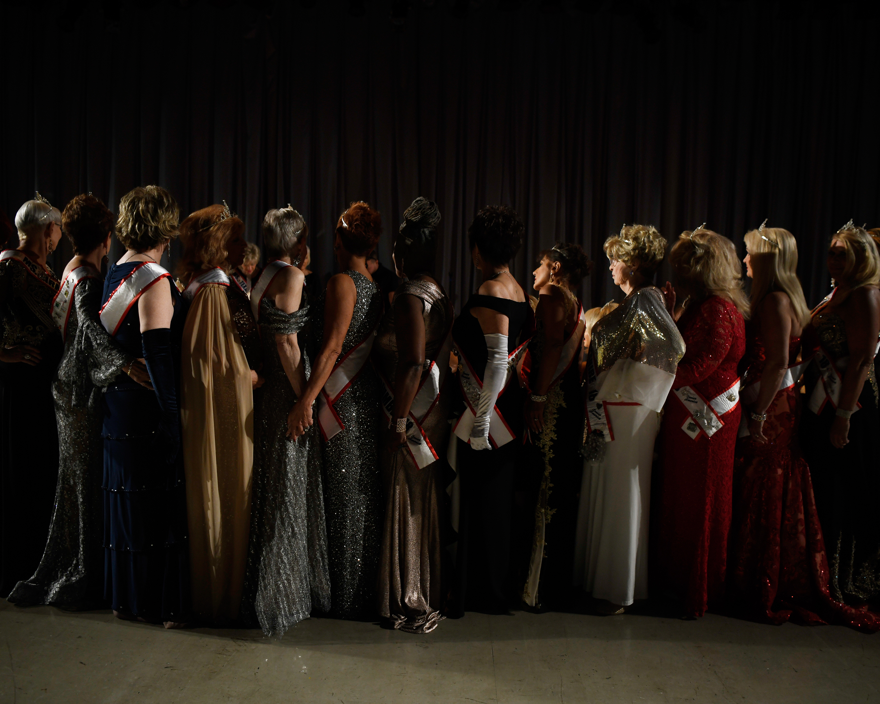 Ms. Senior America contestants line up to take a photo before the pageant finals in Atlantic City, N.J. on Oct. 18, 2018.