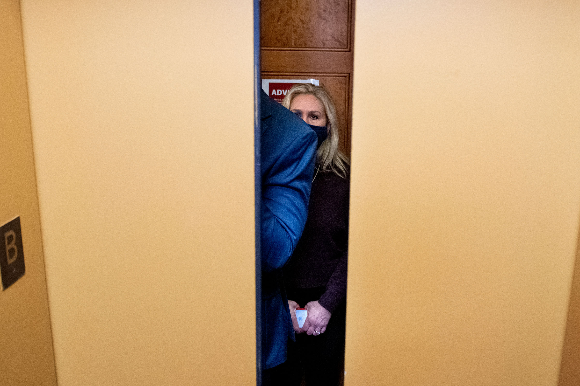 Representative Marjorie Taylor Greene boards an elevator as she makes her way for a vote on House Floor on Feb 4, 2021.