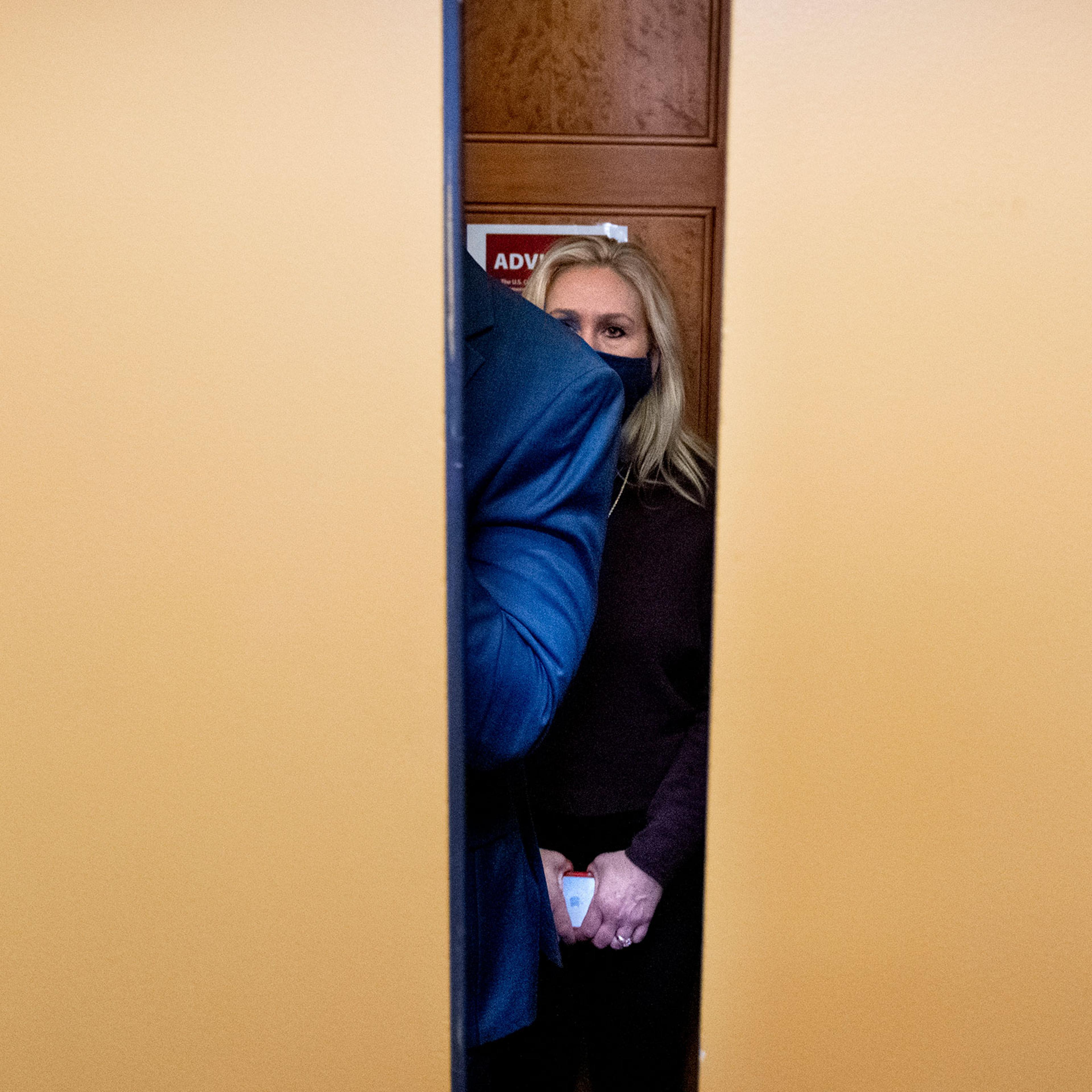 Representative Marjorie Taylor Greene boards an elevator as she makes her way for a vote on House Floor on Feb 4, 2021.