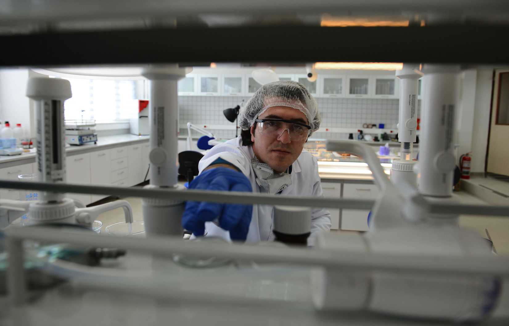 An officer at the forensic laboratory of the Turkish National Police. In the future, crime busters might be able to create mugshots from a single strand of hair