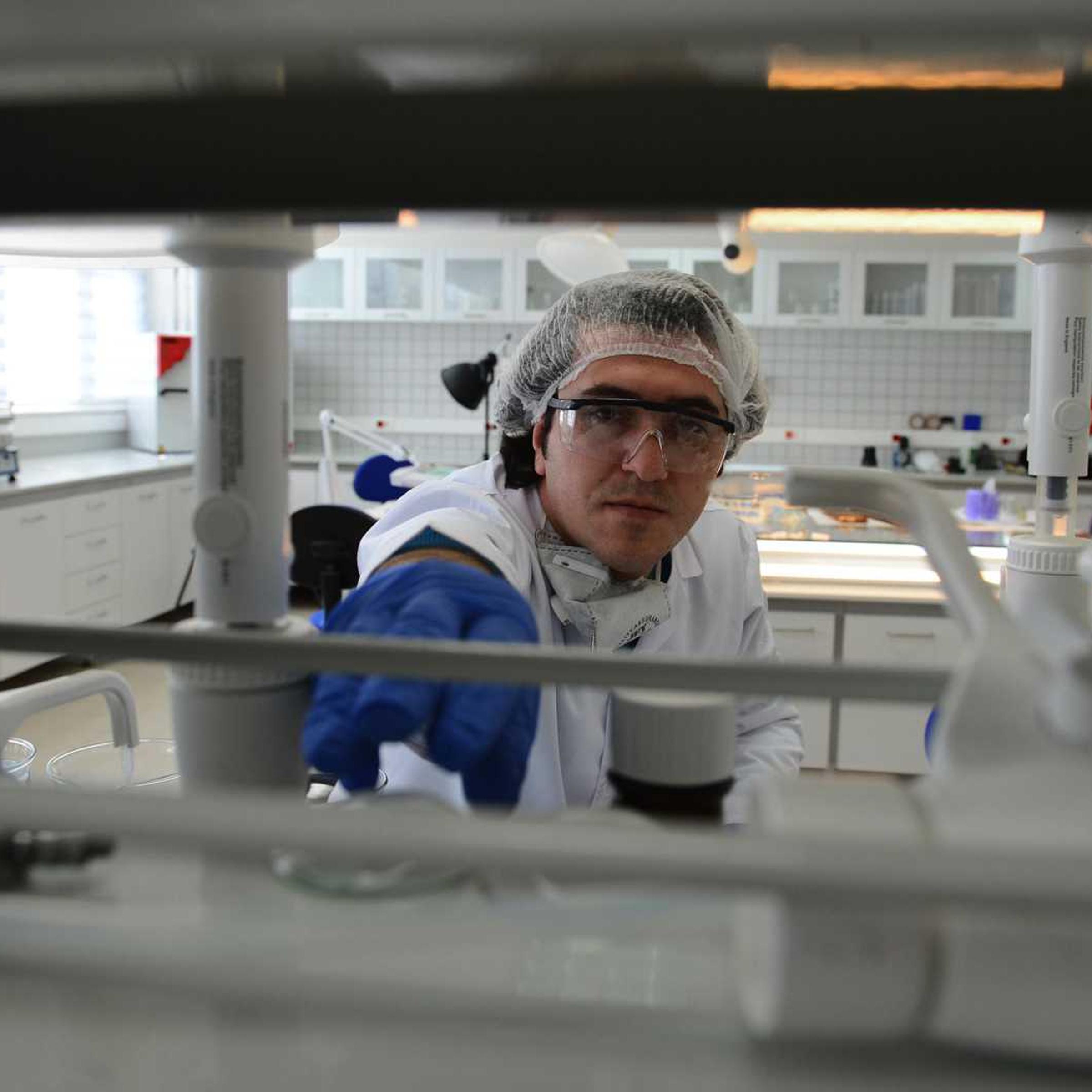An officer at the forensic laboratory of the Turkish National Police. In the future, crime busters might be able to create mugshots from a single strand of hair