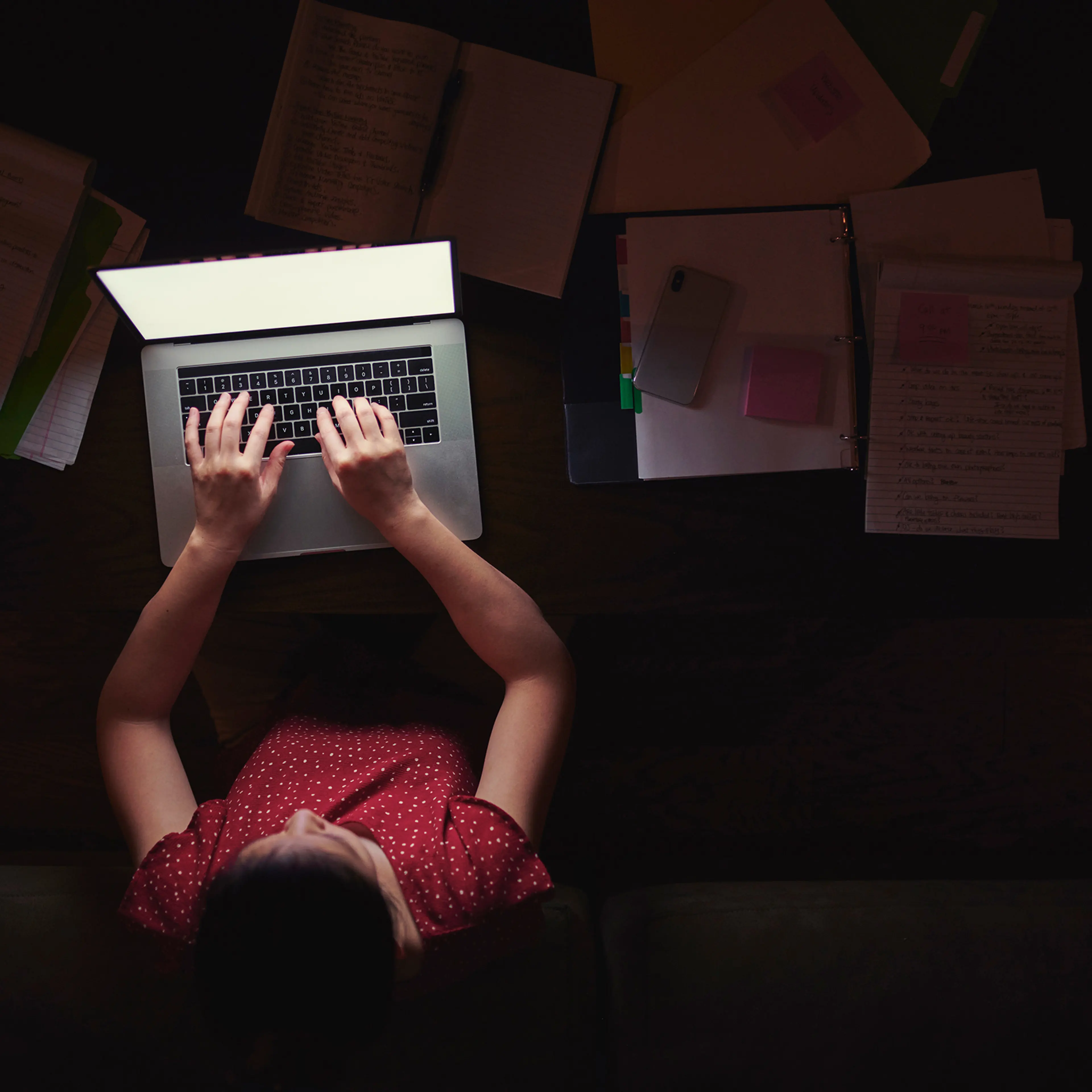 Woman working from home late at night