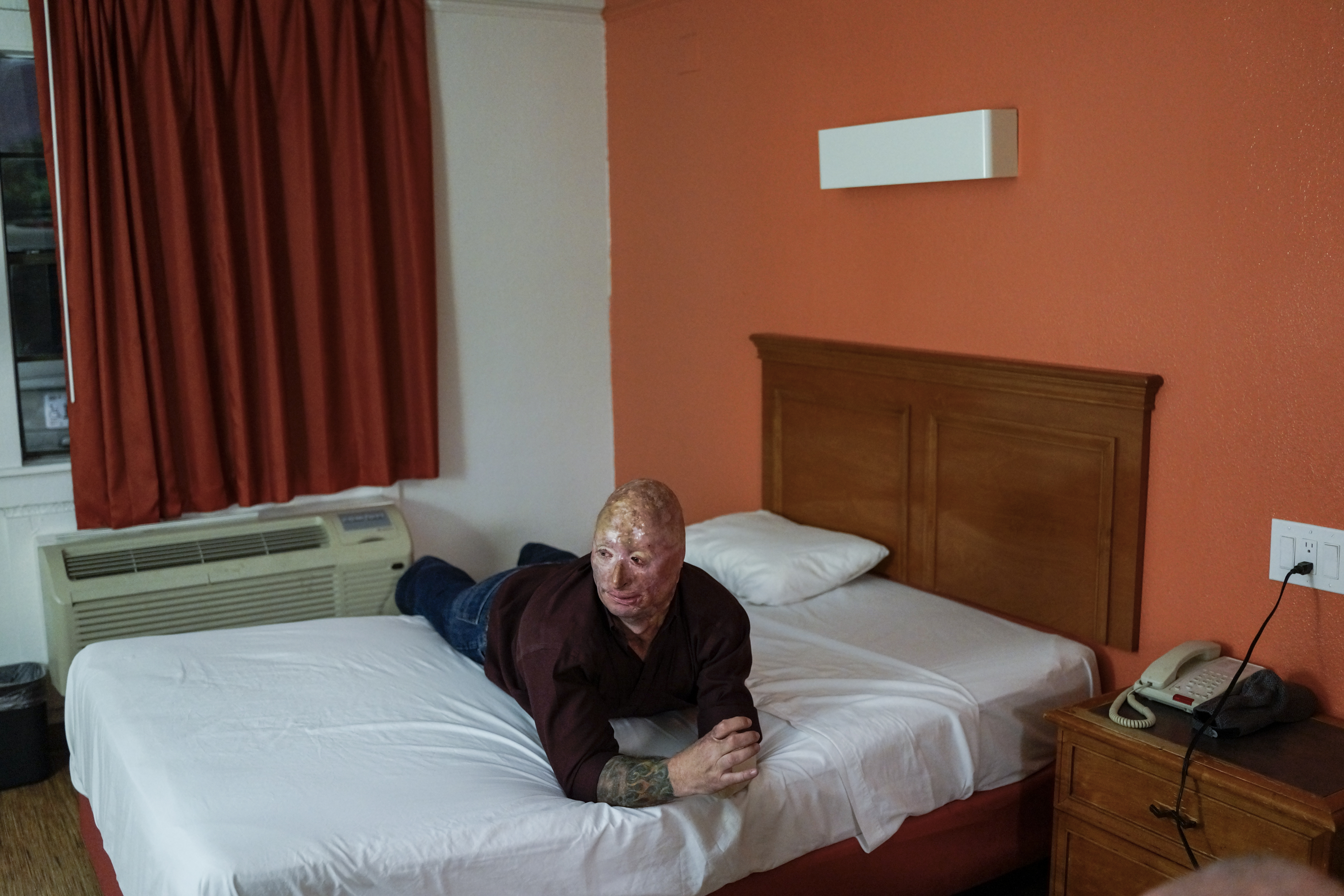 2013.  Dallas, TX.  USA.  Bobby in his Motel 6 room after performing his comedy routine.   Bobby Henline, 41, veteran of four tours to Iraq and sole survivor of an IED blast that killed the other four soldiers in his humvee in Iraq in 2007.  He is now a 