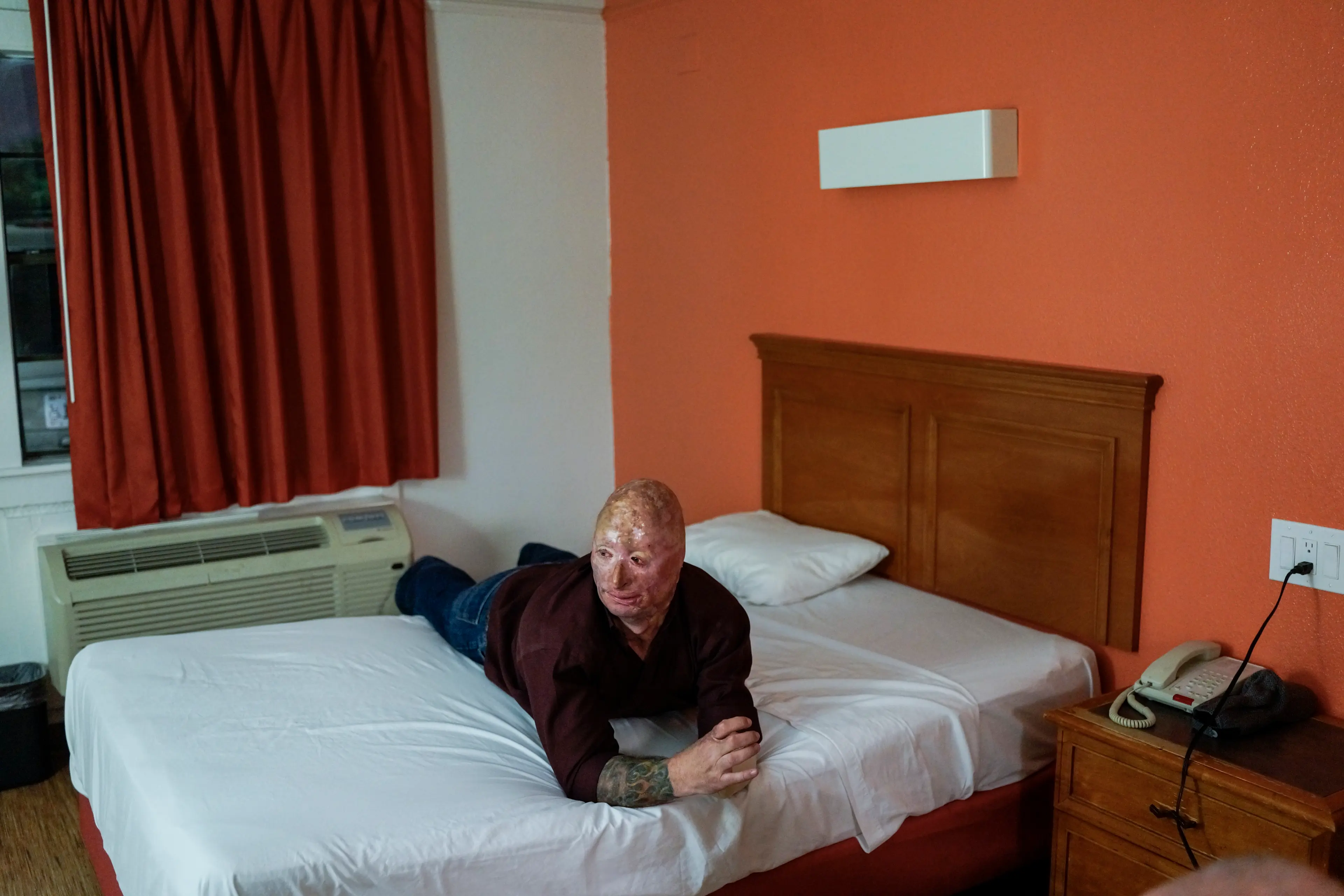 2013. Dallas, TX. USA. Bobby in his Motel 6 room after performing his comedy routine. Bobby Henline, 41, veteran of four tours to Iraq and sole survivor of an IED blast that killed the other four soldiers in his humvee in Iraq in 2007. He is now a