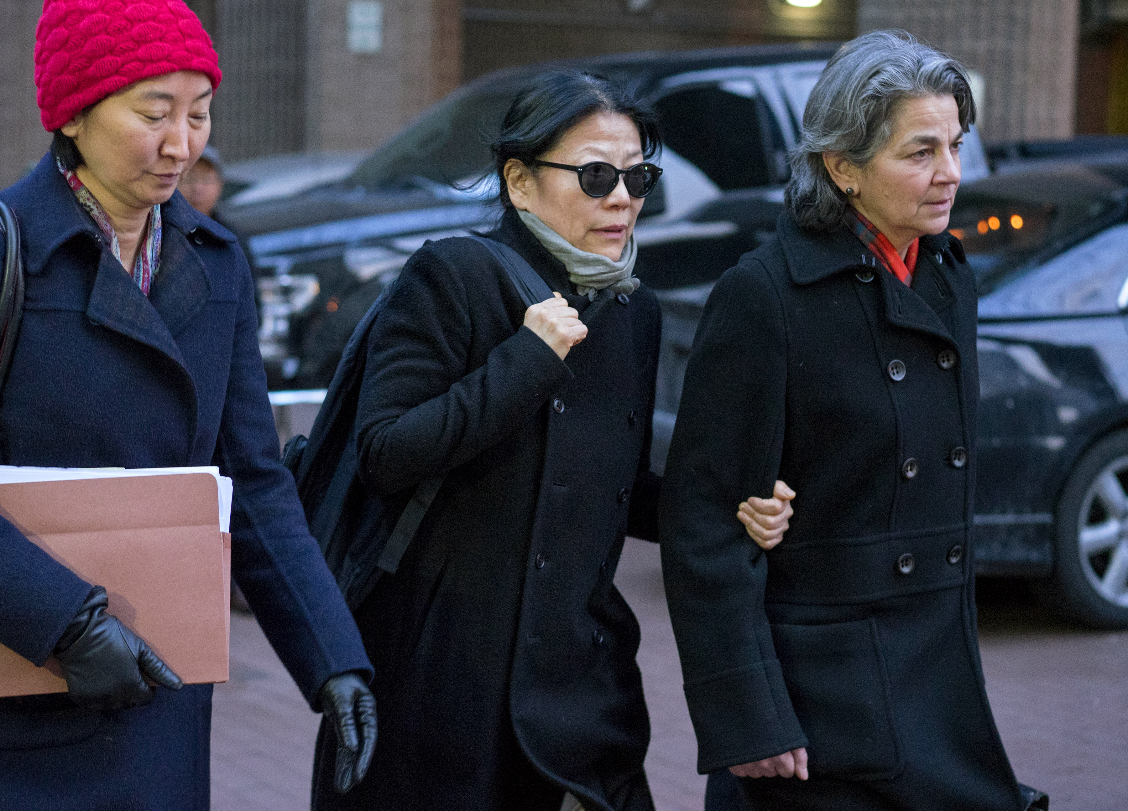 Sheri Yan, CEO of Global Sustainability Foundation, center, leaves federal court in New York after she plead guilty in connection with a scheme to bribe ex-UN General Assembly President John Ashe on Jan. 20, 2016.