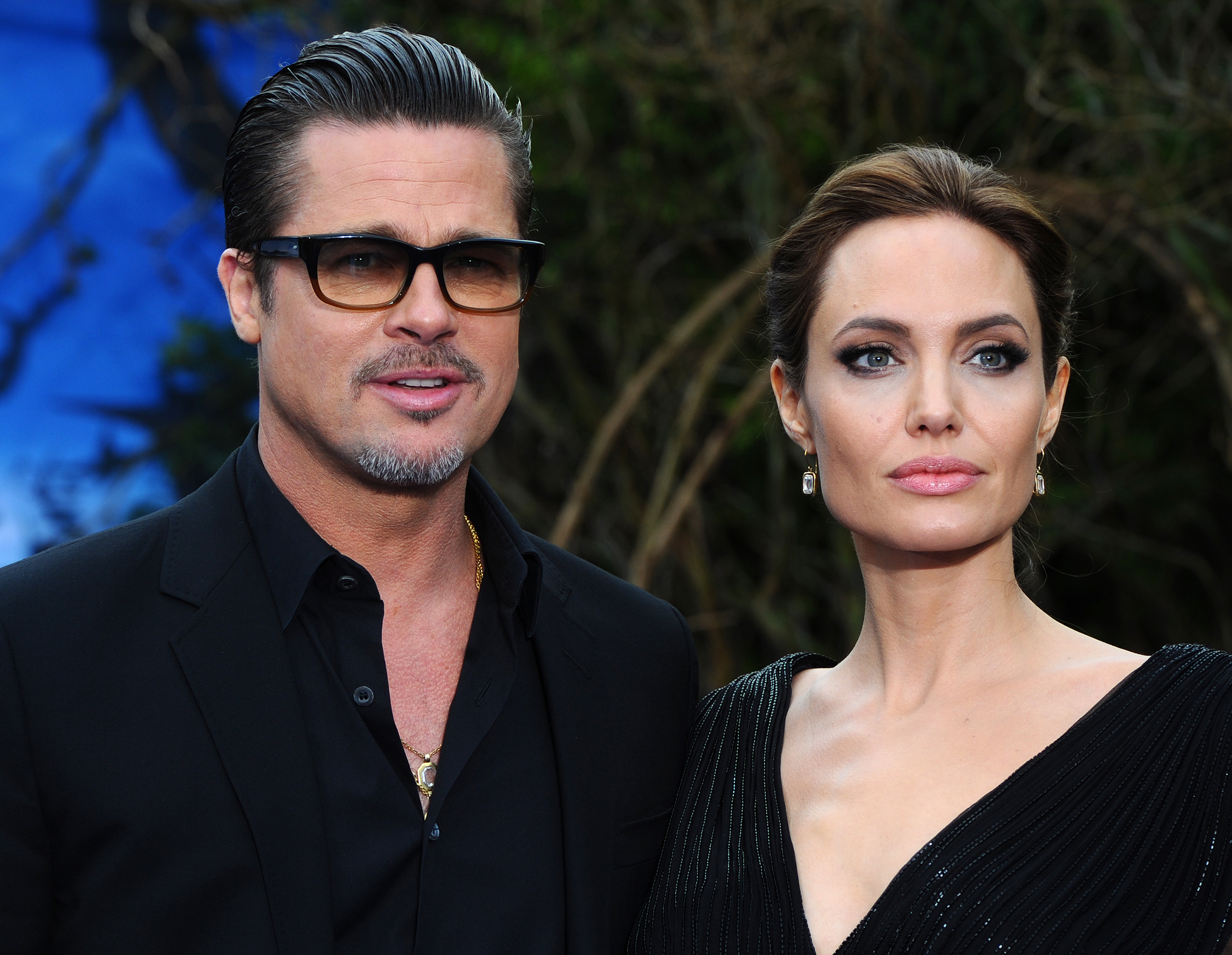 Brad Pitt and Angelina Jolie attend a private reception as costumes and props from Disney's "Maleficent" are exhibited in support of Great Ormond Street Hospital at Kensington Palace in London on May 8, 2014.