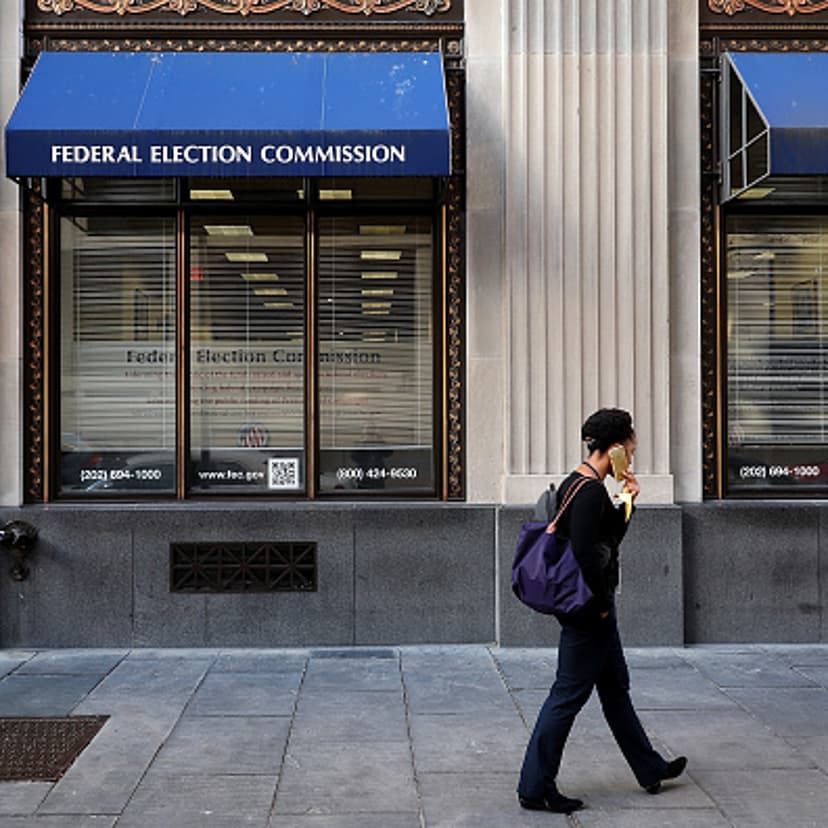 A pedestrian walks past the Federal Election Commission's headquarters October 24, 2016 in Washington, DC.
