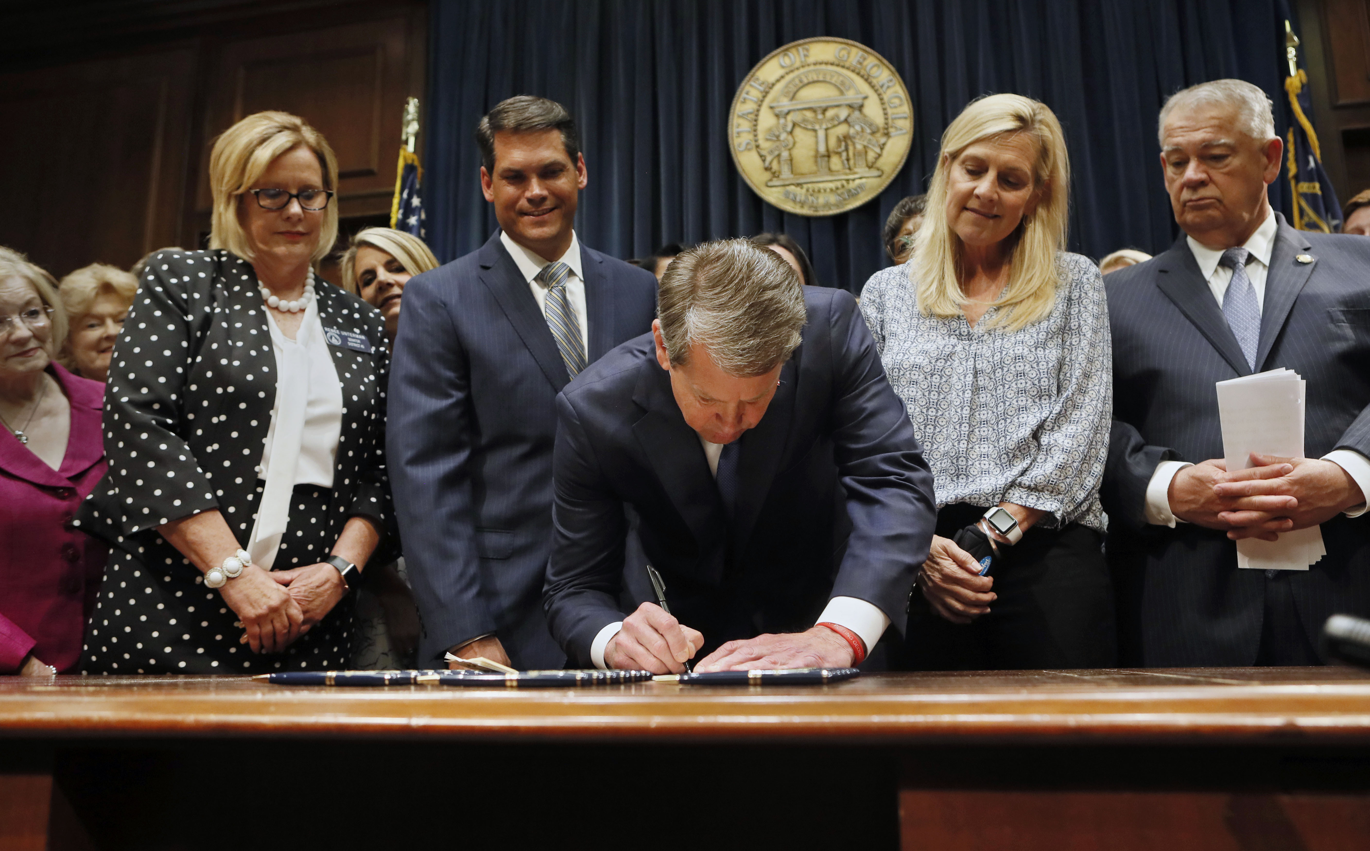 Georgia's Republican Gov. Brian Kemp signed legislation banning abortions once a fetal heartbeat can be detected.