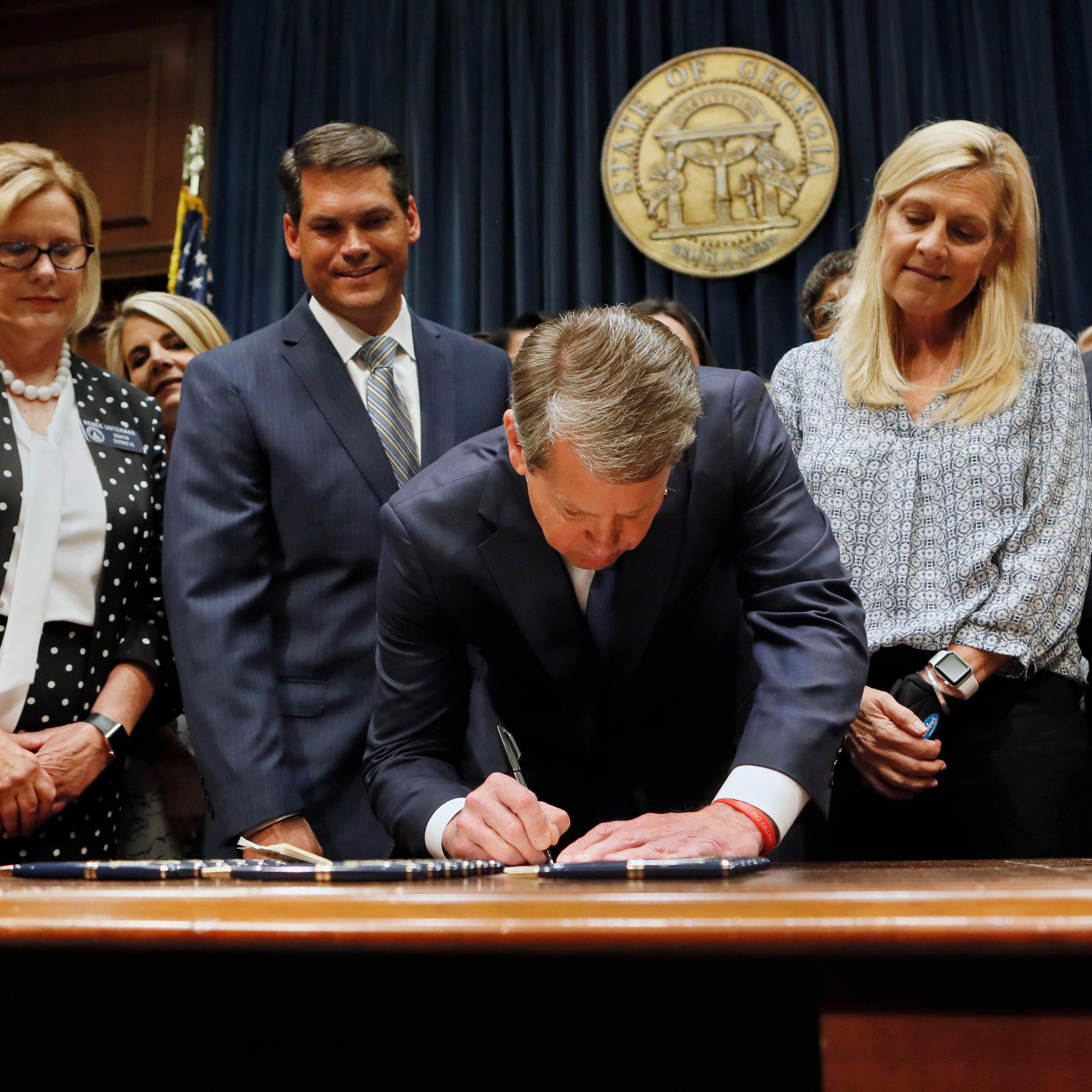 Georgia's Republican Gov. Brian Kemp signed legislation banning abortions once a fetal heartbeat can be detected.