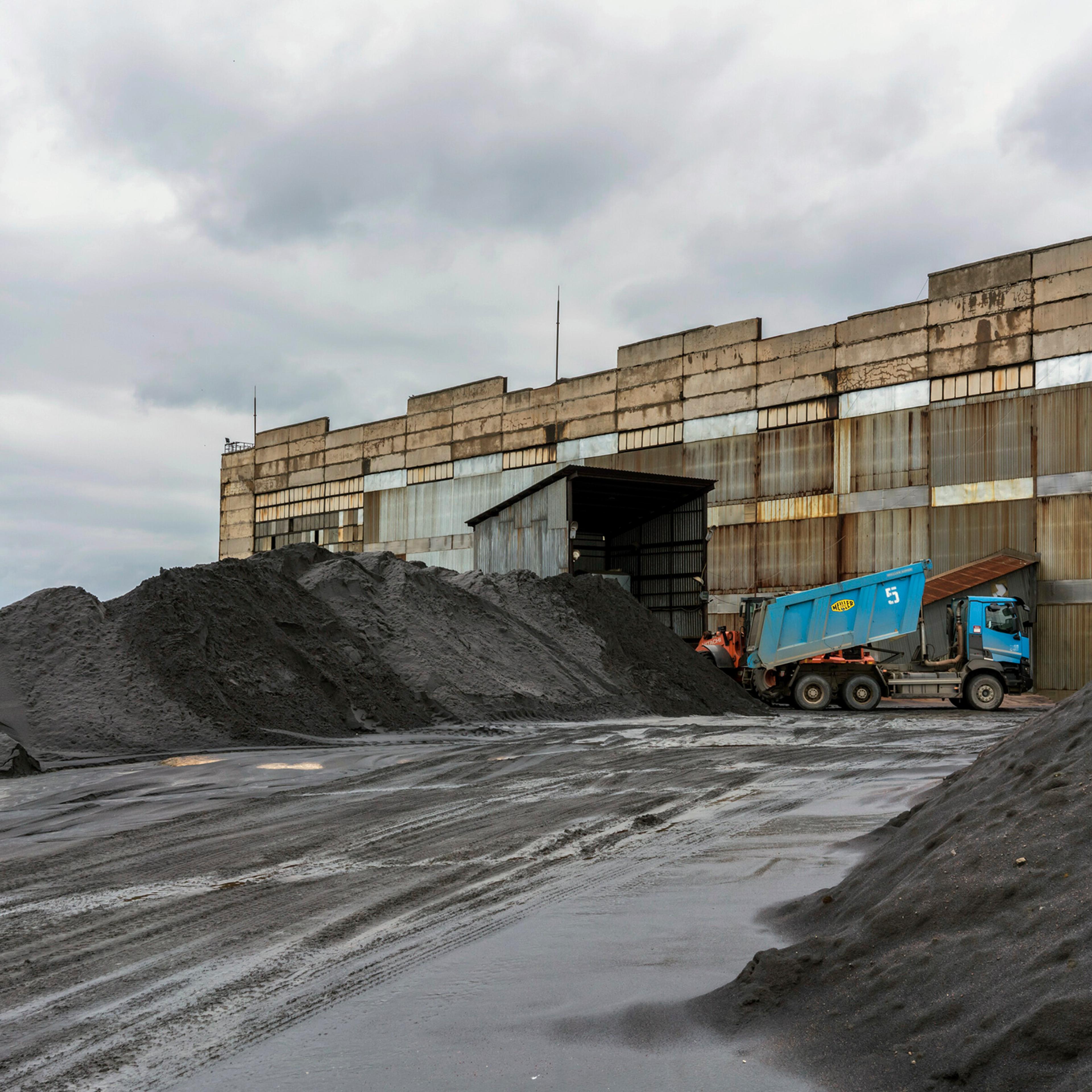 A truck unloads partially refined titanium ore at a factory east of Kyiv, in the Zhytomyr region of Ukraine, June 12, 2024.