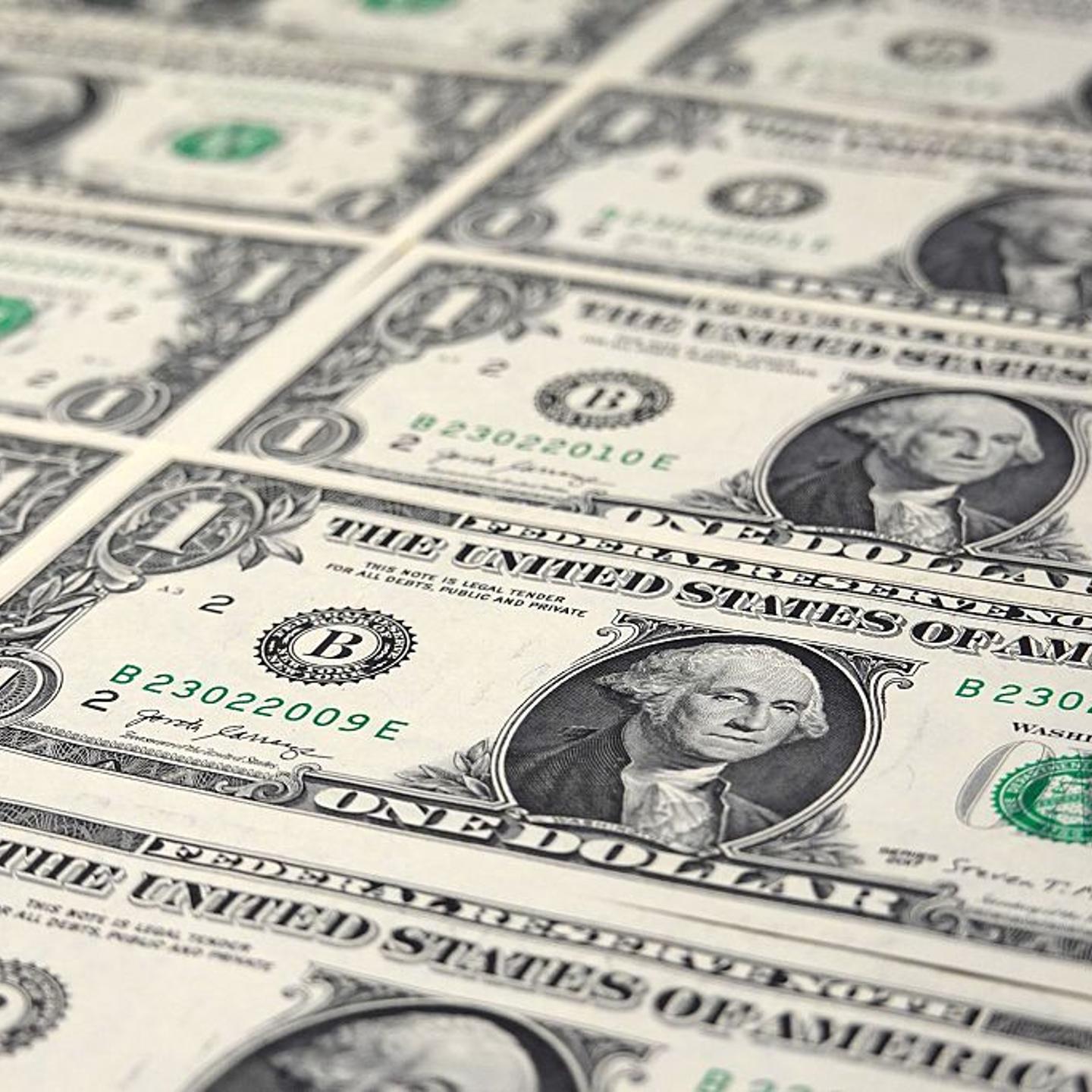 In this photo illustration, several $1 bills are seen