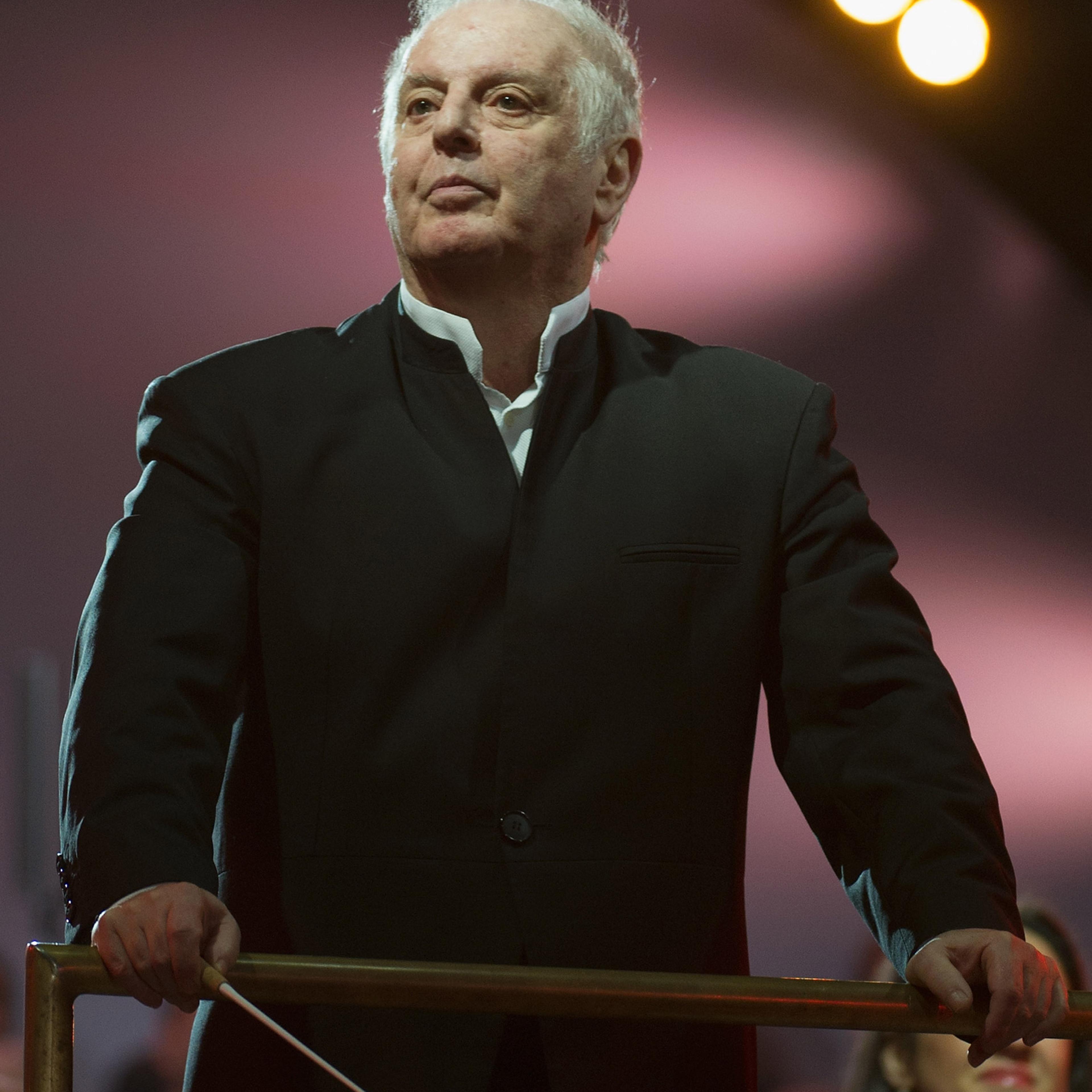 BERLIN, GERMANY - NOVEMBER 09: Conductor Daniel Barenboim performs at Brandenburg Gate during celebrations on the 25th anniversary of the fall of Wall on November 9, 2014 in Berlin, Germany. The city of Berlin is is commemorating the 25th anniversary of