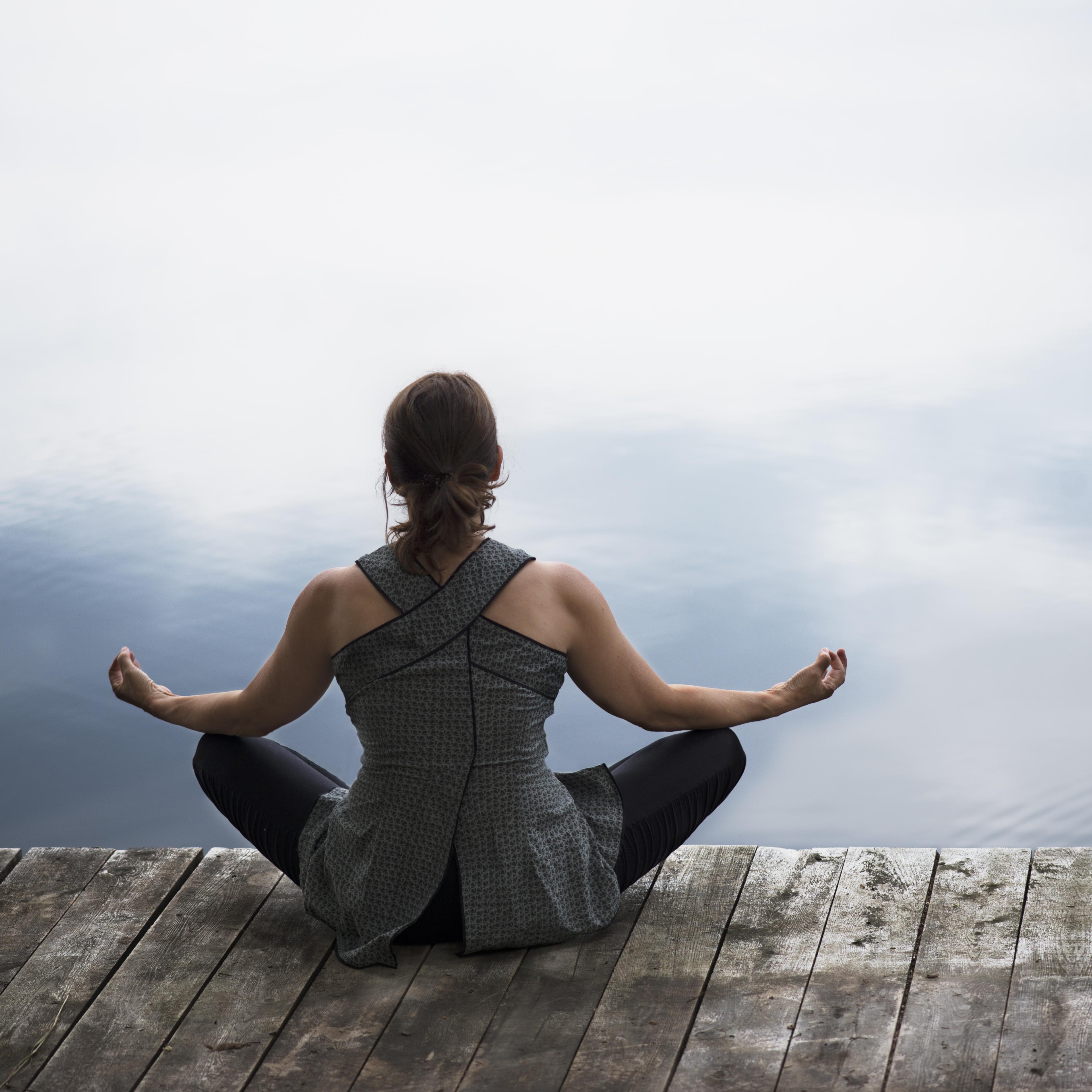 Woman doing asana yoga at the end of day