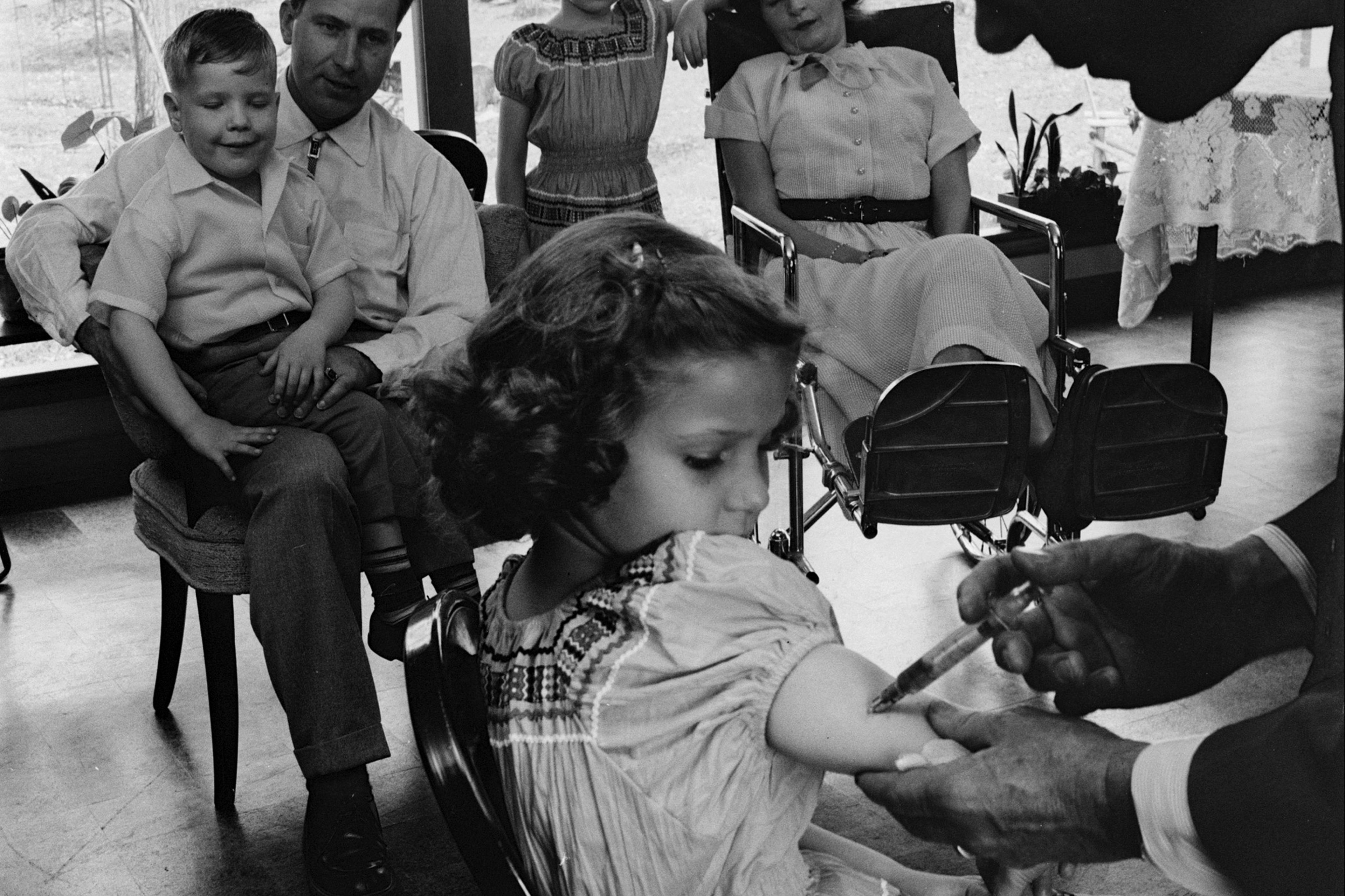 Child receiving a polio vaccination, 1955.