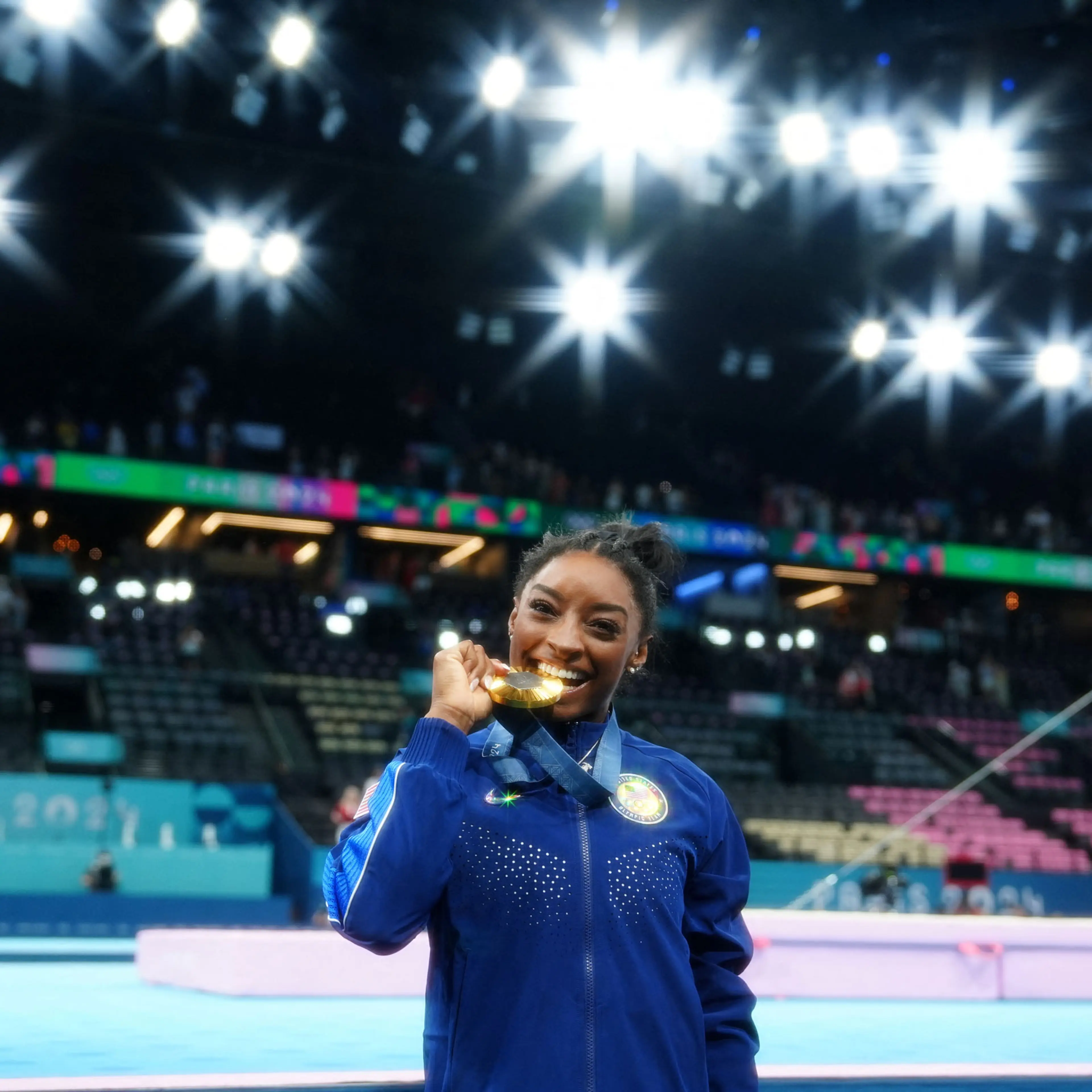 Gold medalist Simone Biles of United States celebrates after winning the women’s gymnastics all-around final.